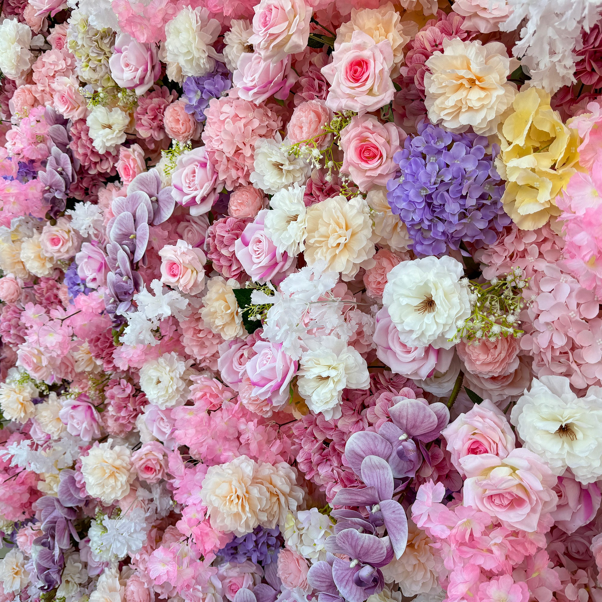 This photo from ValarFlowers showcases a lush floral arrangement. It features roses in soft pink, white, and peach tones, hydrangeas in purple and pink, along with delicate white flowers and small green - stemmed blooms. Large purple orchids add an elegant touch. Ideal for weddings, bridal showers, or romantic events, this dreamy and colorful mix exudes charm and sophistication.
