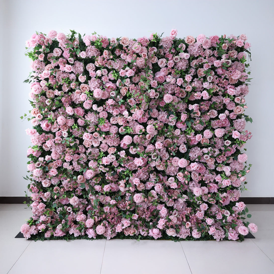 This image showcases a large, square floral wall indoors. It&