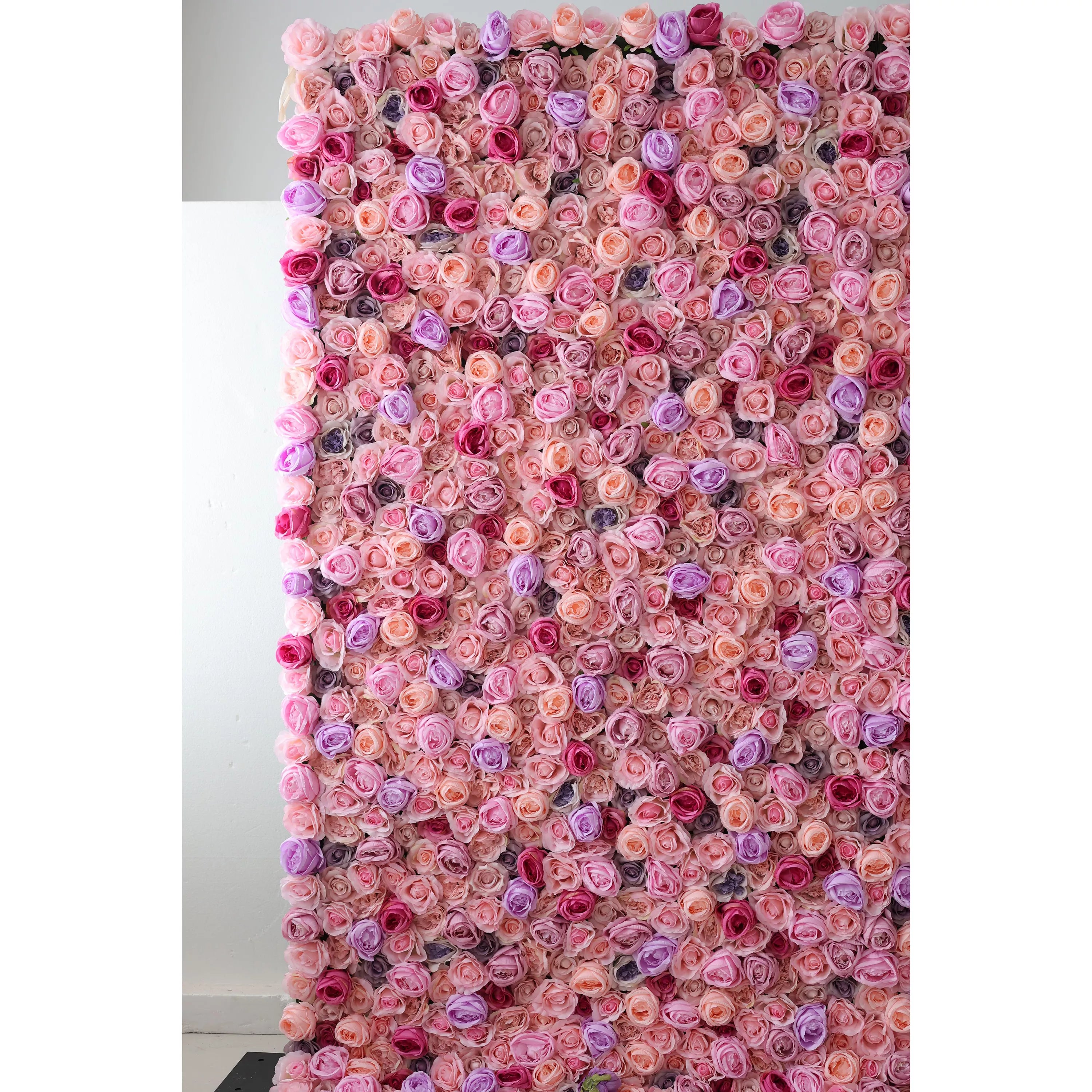 This large artificial flower wall features a dense, vibrant mix of pink, peach, purple, and red roses. The harmonious arrangement creates a lush, romantic texture, exuding elegance. Ideal as an event backdrop, it brings a dreamy, charming atmosphere with its intricate, colorful floral design.