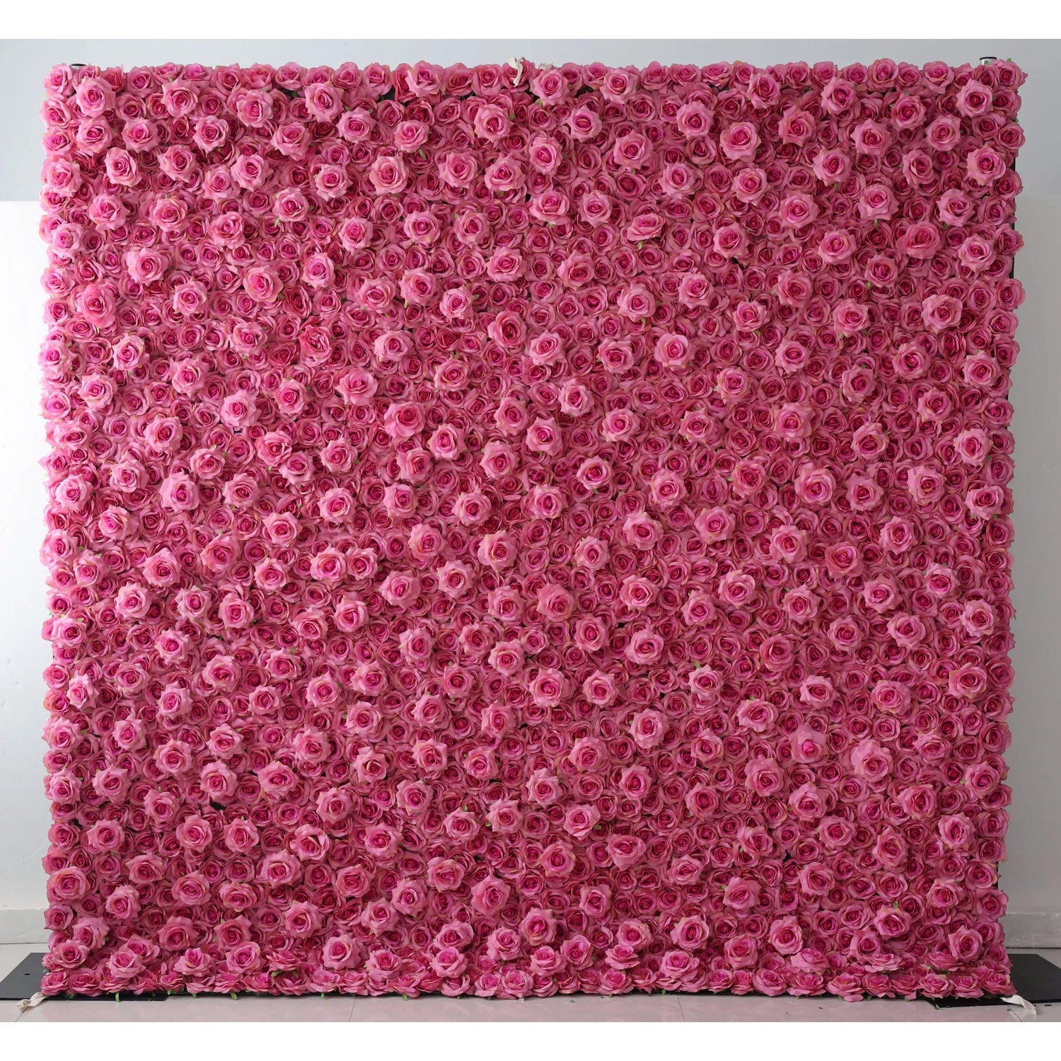 This is a massive artificial flower wall covered densely with uniform pink roses. The soft, consistent hue creates a romantic, dreamy vibe. Ideal for backdrops at weddings, events, or photo shoots, it brings an elegant, enchanting touch, filling the space with a gentle, feminine charm.