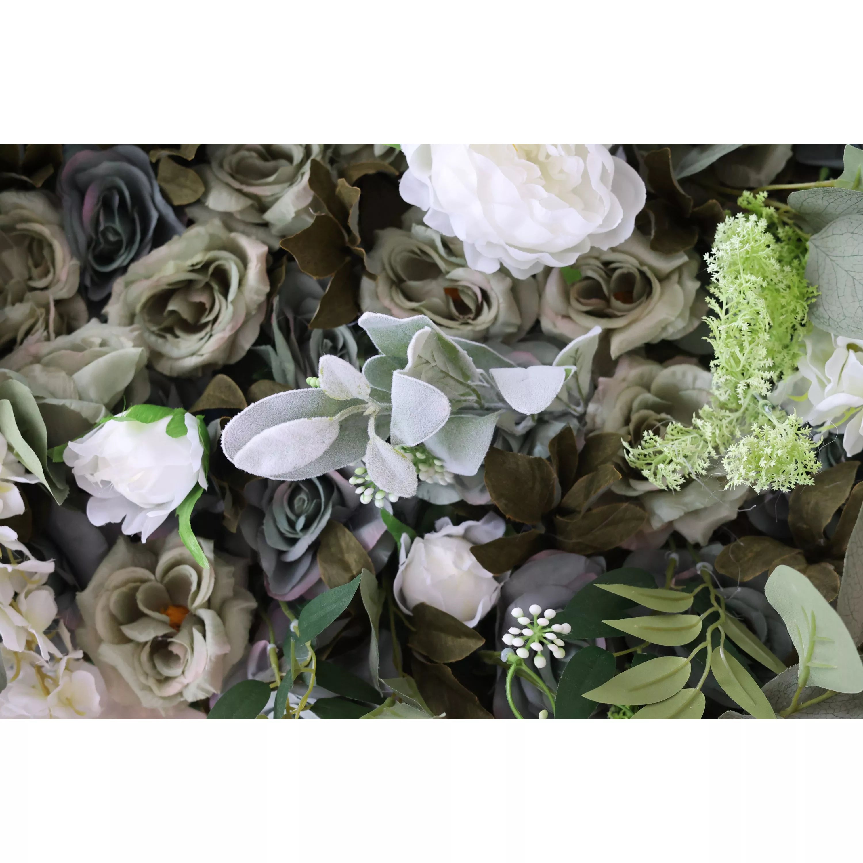 A close - up of an artificial flower wall with grayish - green roses, white peonies, soft gray foliage, and delicate greenery. The mix of textures and muted tones creates a sophisticated, natural - looking arrangement, perfect for elegant decor.