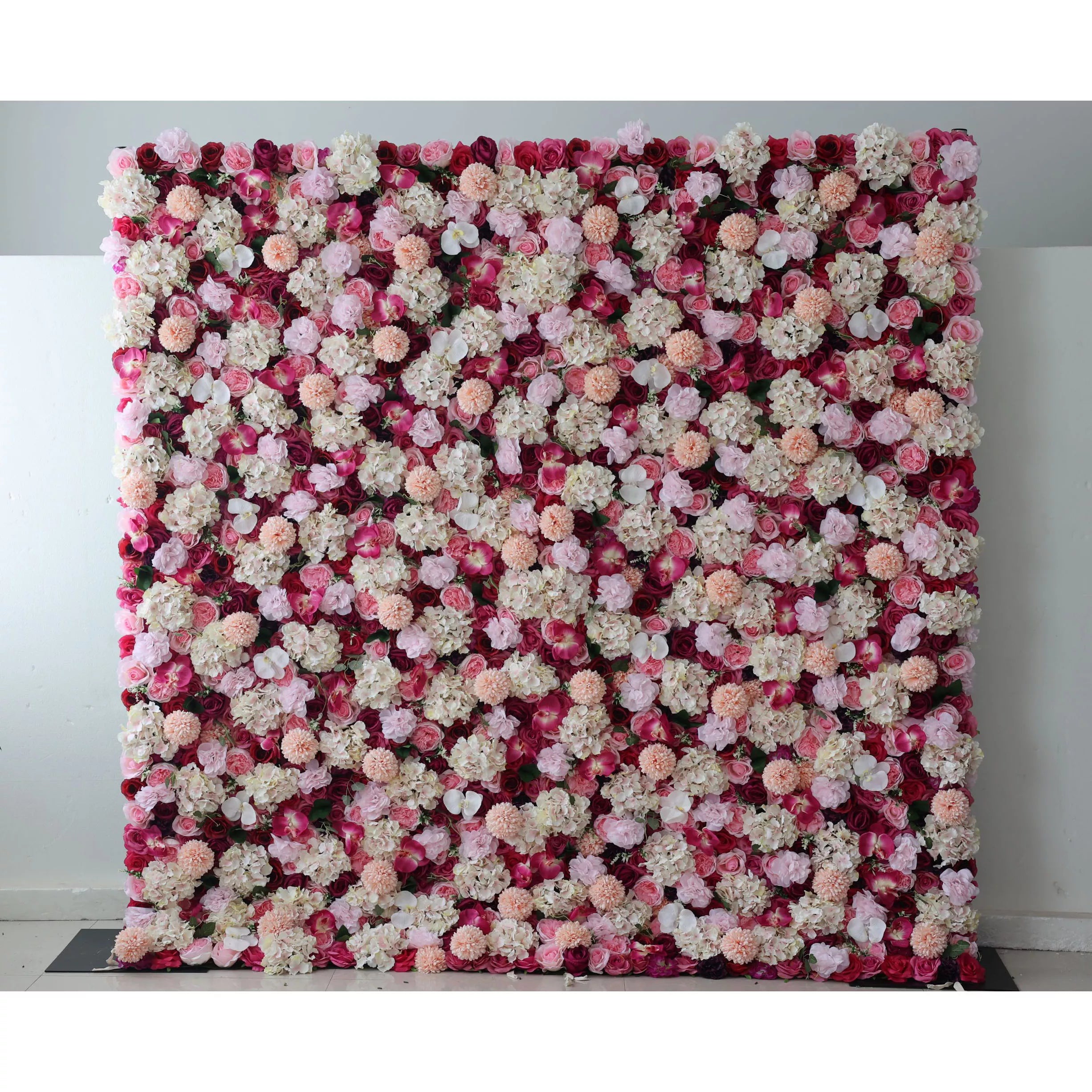 Valar Flowers: This large artificial flower wall features a rich mix of blooms. Red blossoms form the base, adorned with white hydrangeas, pink roses, peach - colored carnations, and small white flowers. The dense, colorful arrangement creates a vibrant, romantic backdrop, ideal for weddings or events, adding an elegant and decorative touch.