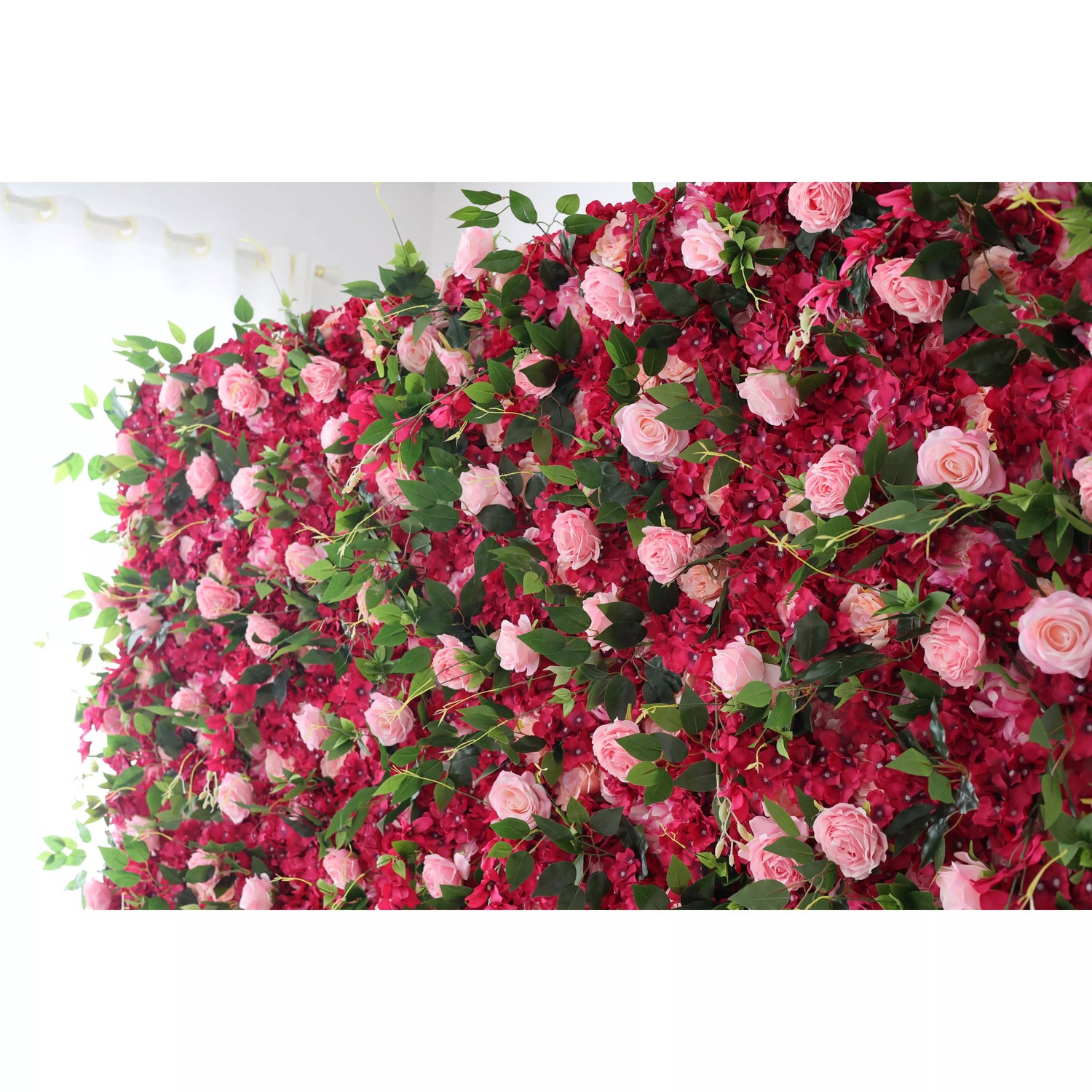 This is a lush artificial flower wall. It features a vibrant mix of deep - red blossoms and soft - pink roses, interspersed with green leaves. The dense, cascading arrangement creates a romantic and eye - catching display, perfect for event backdrops. Ideal for weddings or parties, it adds an elegant, natural - looking touch to the space.