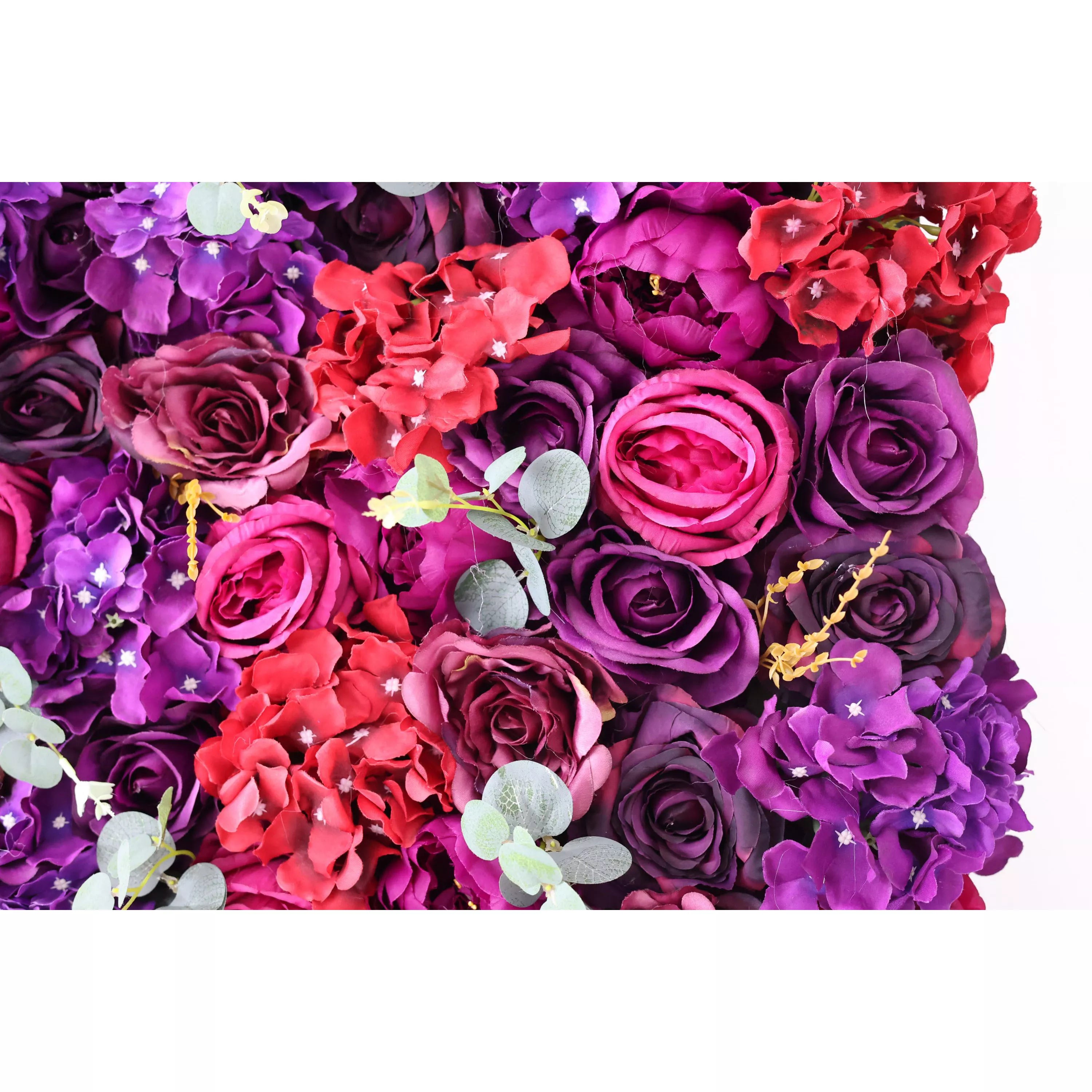 This close - up showcases a lush artificial flower wall, a rich blend of deep purple, magenta, and red blooms. Among them are roses, hydrangeas, and eucalyptus leaves, creating a textured, vibrant tapestry. The dense arrangement and contrasting colors make it an eye - catching backdrop, perfect for events like weddings or parties, adding an elegant and dramatic touch to the space.