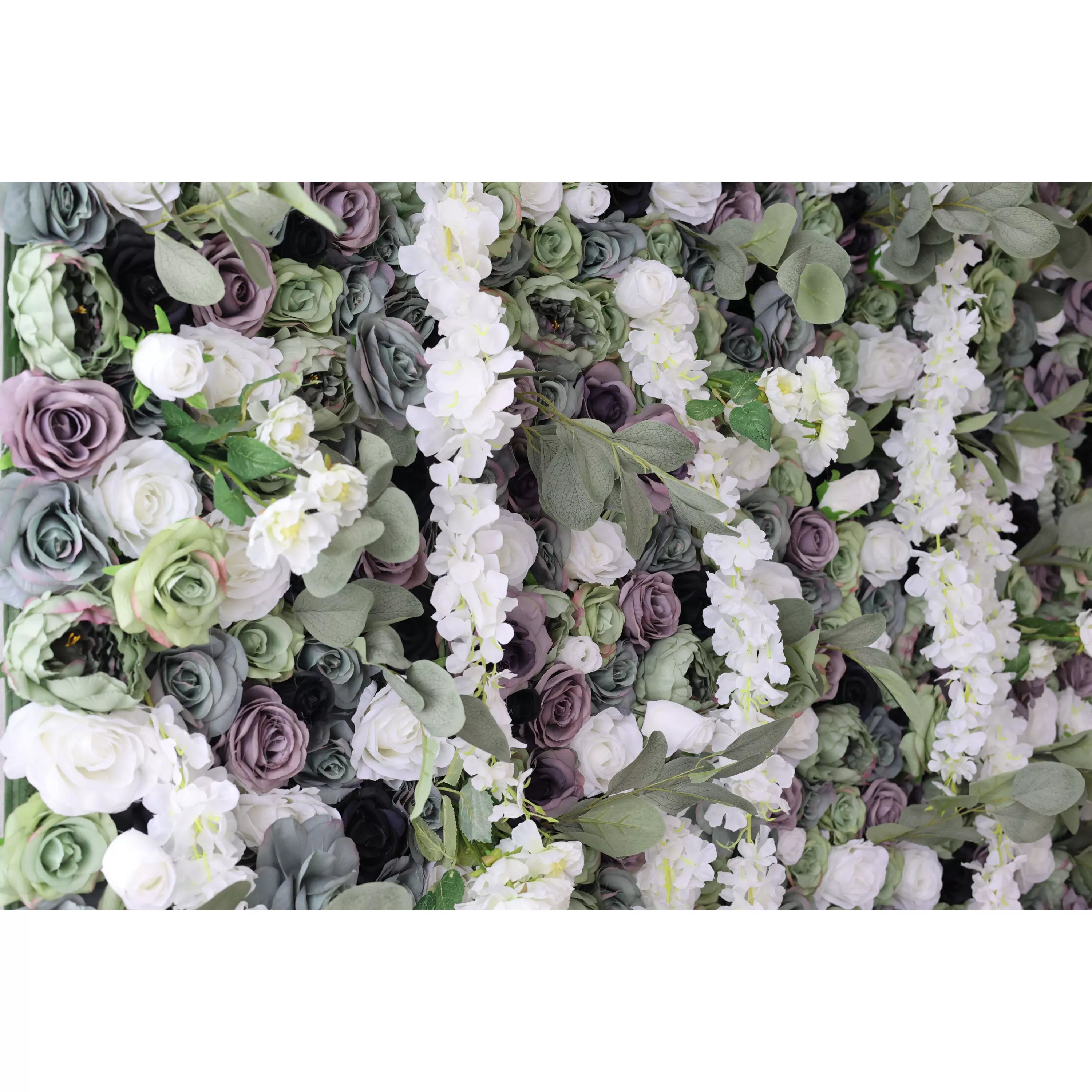 This close - up shows a lush artificial flower wall. It has a mix of white, green, and purple roses, plus white blossoms and green leaves. The dense, textured arrangement creates an elegant, natural - looking display, perfect for decorative backdrops at events like weddings.