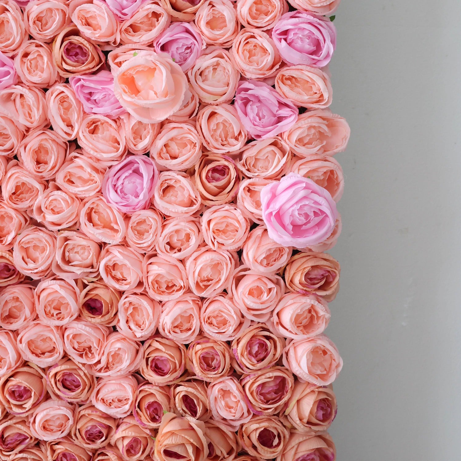 This close - up shows a section of an artificial flower wall. It&