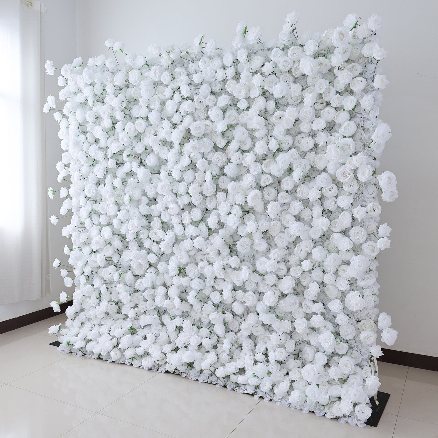 This image features a large, square floral wall indoors. It&
