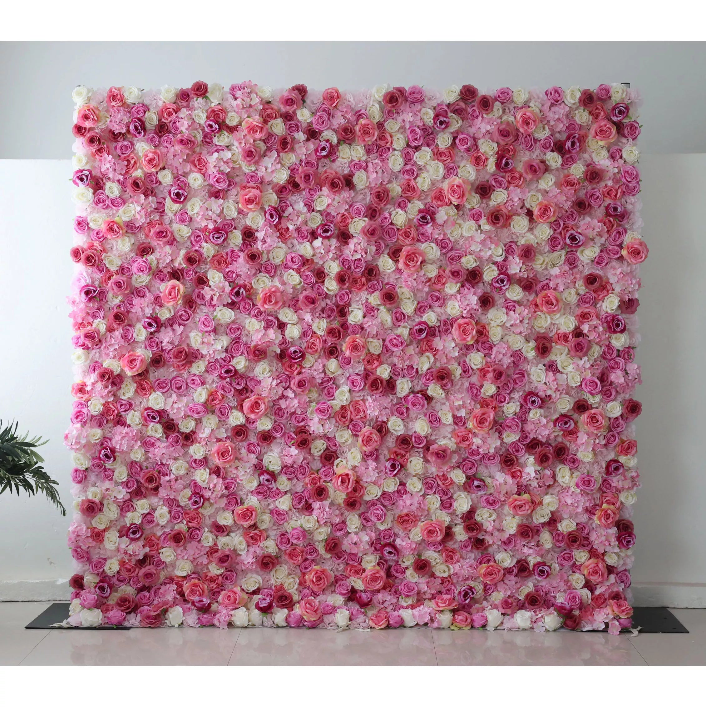 This flower wall is a vibrant, multi - hued display of artificial blooms. It blends pink, white, and purple roses, plus delicate flowers, creating a lush, textured pattern. The dense arrangement and varied colors evoke a cheerful, romantic vibe, perfect for weddings or events, offering a captivating backdrop for photos.