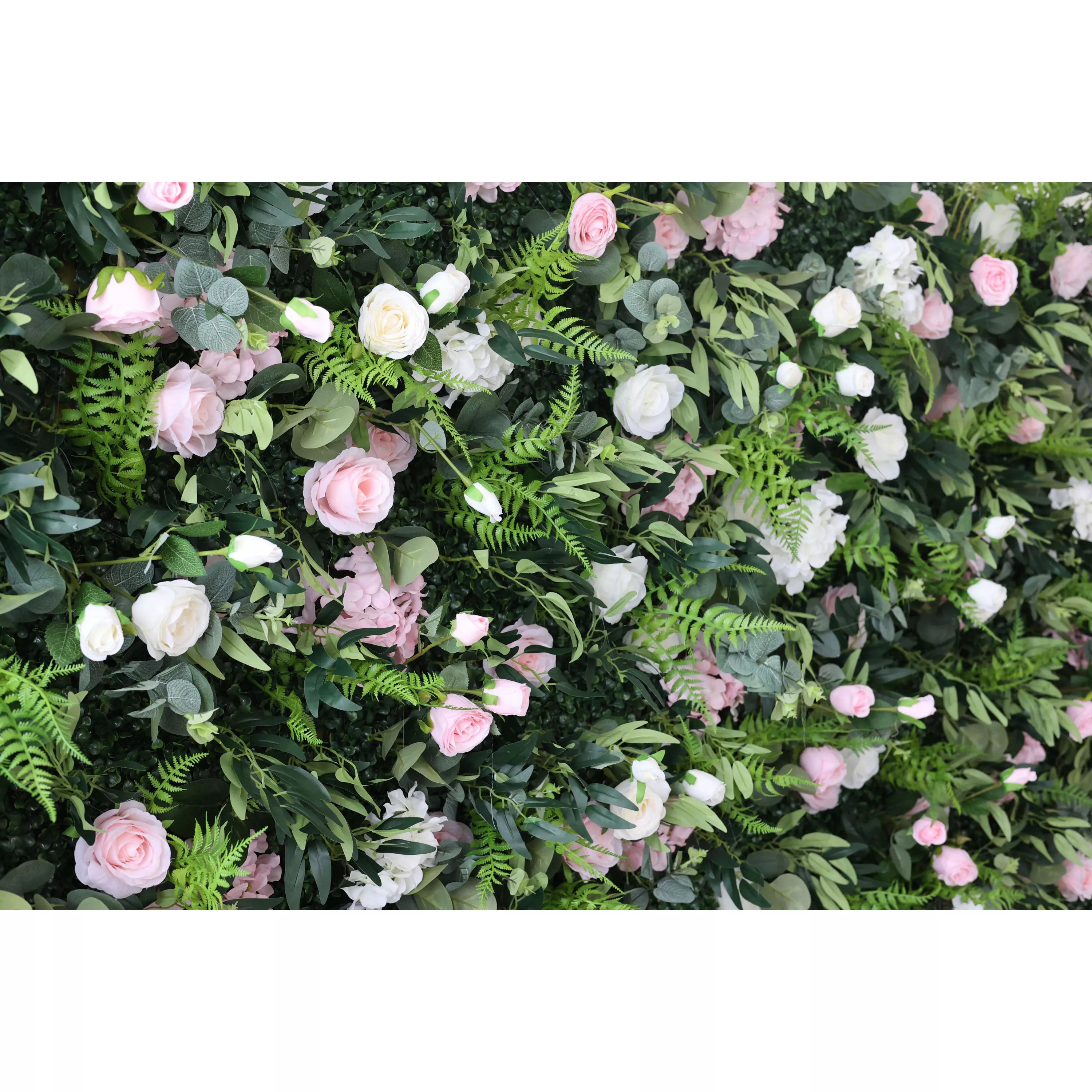 This close-up captures a lush floral wall with a dense, textured backdrop of deep green foliage, including ferns and eucalyptus leaves. It is interspersed with a romantic mix of blush pink roses, soft white roses, and delicate filler flowers. The layered, organic design creates a rich, three-dimensional texture, evoking a fresh, natural, and romantic atmosphere ideal for weddings, photo backdrops, or elegant celebrations.