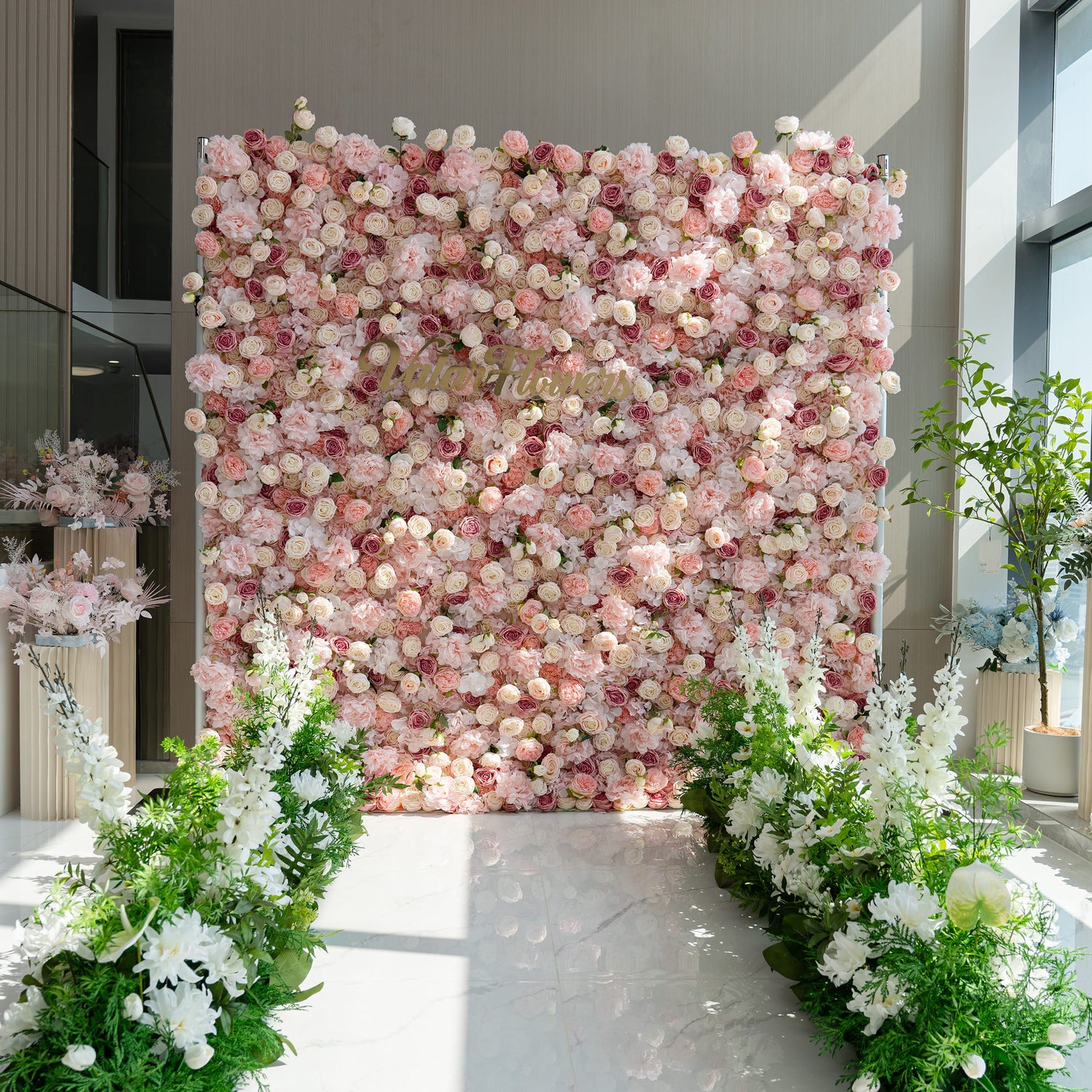 The floral arrangement features a lush, pink - toned flower wall with the text "Valar Flowers" prominently displayed. The white flower aisle guides are perfect for weddings, creating a romantic and elegant pathway for the bride to walk down.