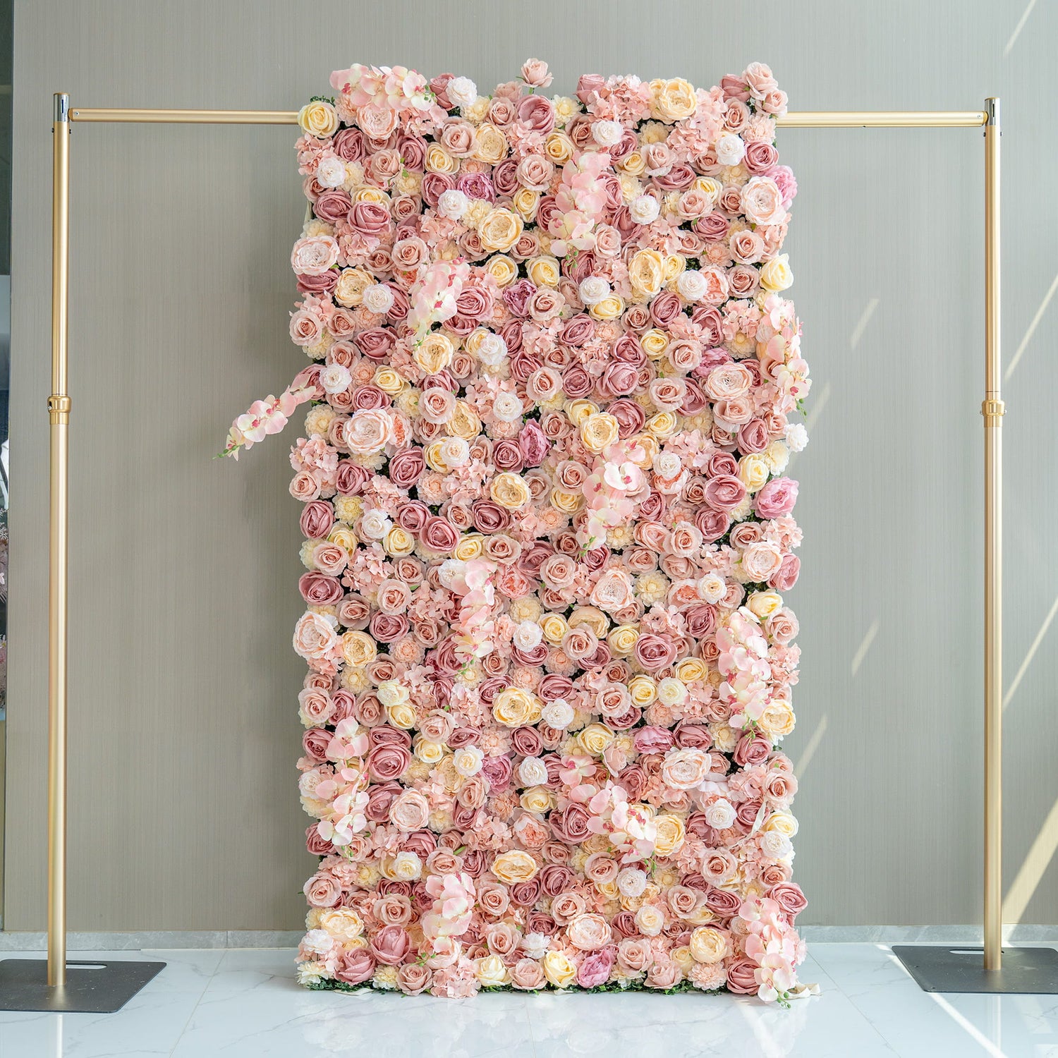 This 1.2*2.4m flower wall is adorned with artificial roses in soft pink, peach, and cream tones. Set on a gold - framed structure, it exudes a romantic and elegant style, perfect for event backdrops.