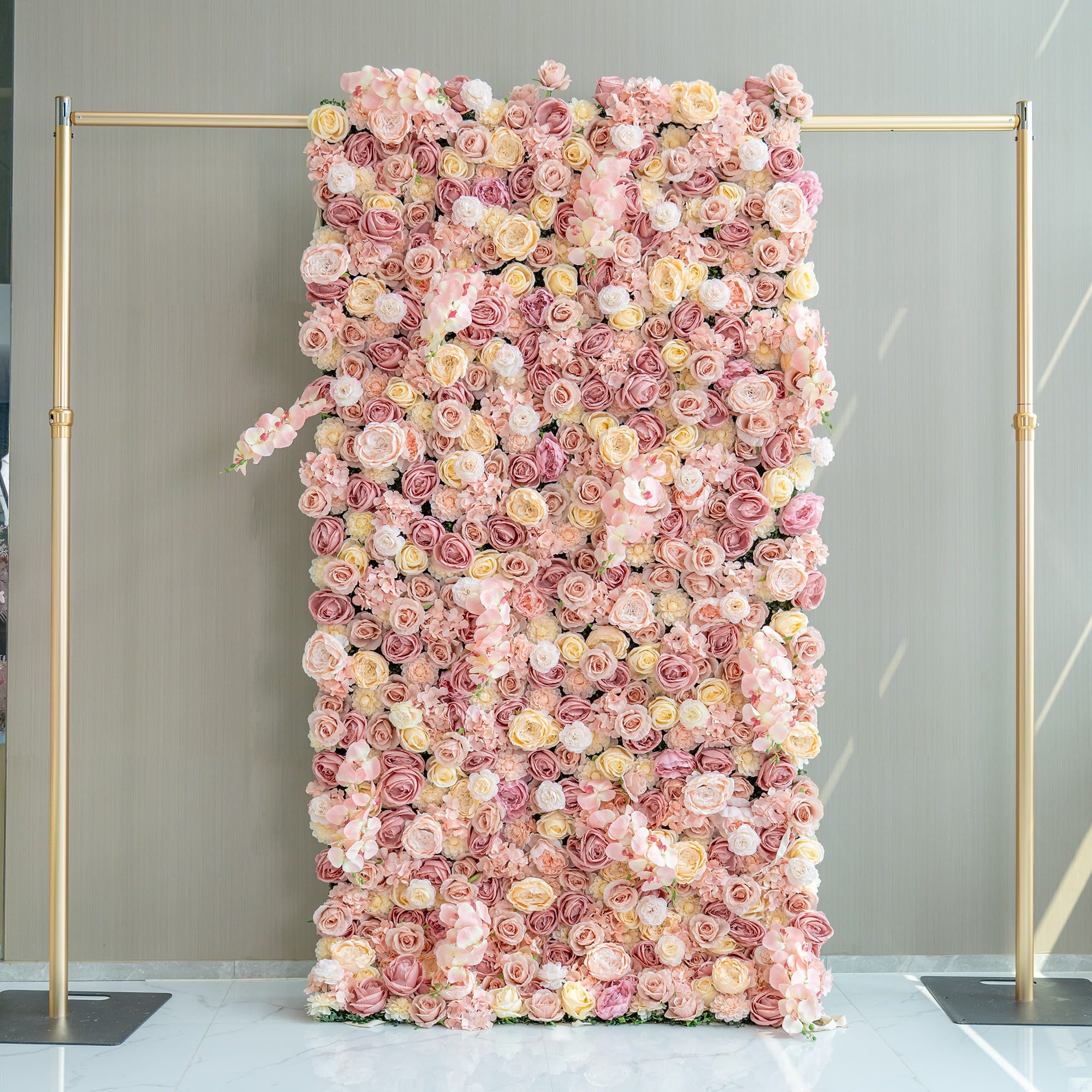 This 1.2*2.4m flower wall is adorned with artificial roses in soft pink, peach, and cream tones. Set on a gold - framed structure, it exudes a romantic and elegant style, perfect for event backdrops.