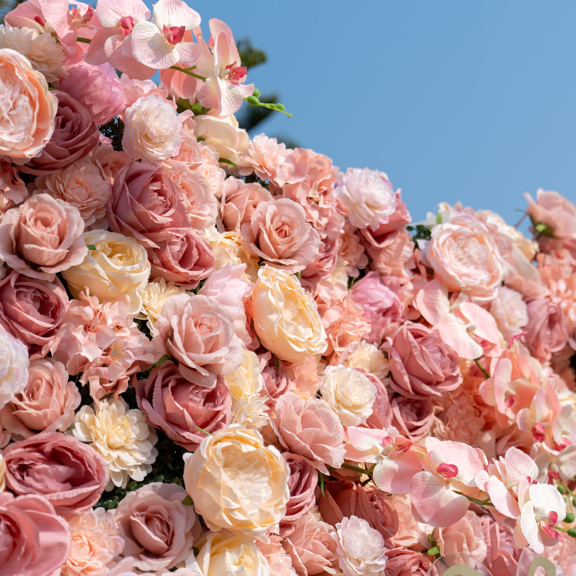 This close - up showcases an arrangement of artificial roses, hydrangeas, and orchids. In soft pastel shades of pink and cream, it creates a delicate, romantic, and elegant style.