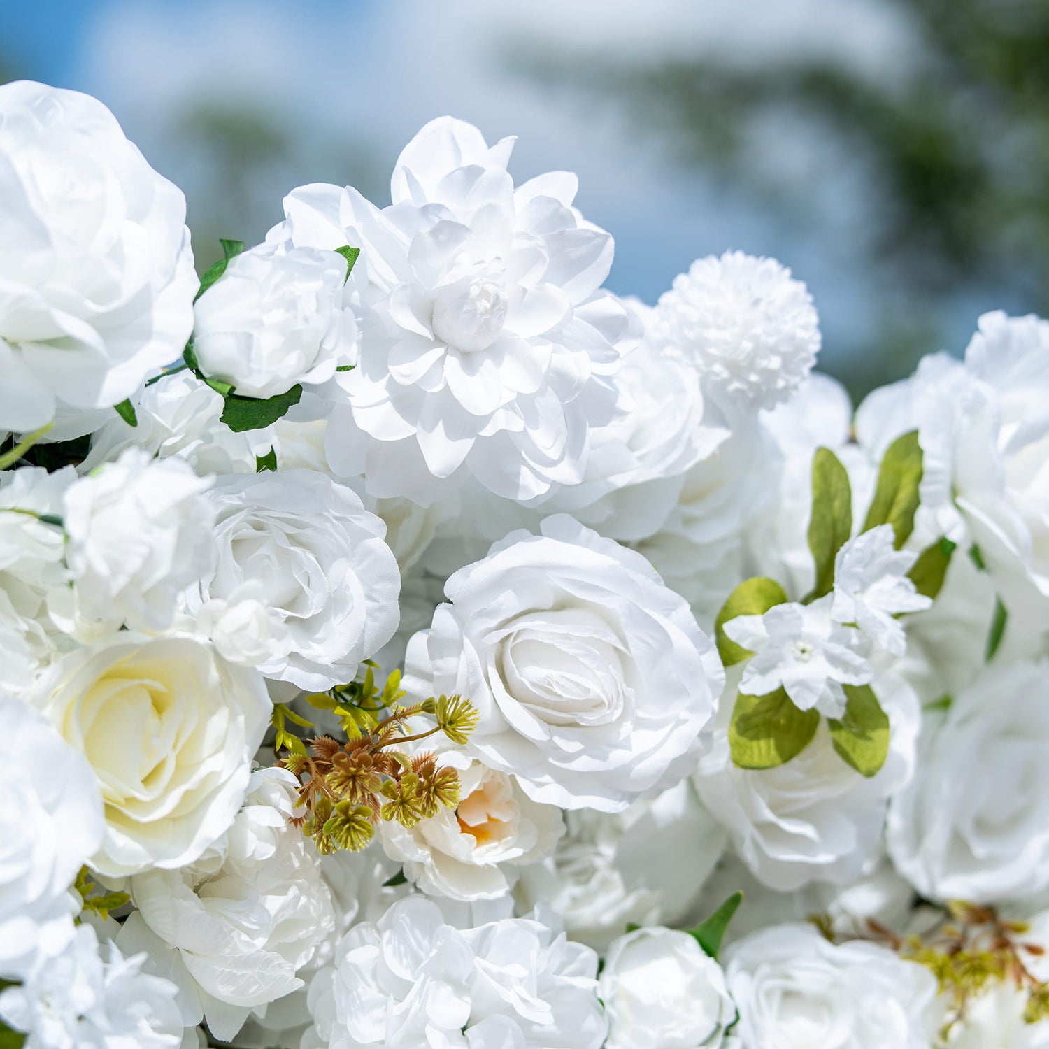 This backdrop showcases a dense arrangement of artificial white flowers, including roses, peonies, and small blossoms, interspersed with green leaves. The all - white palette exudes purity and elegance.
It&