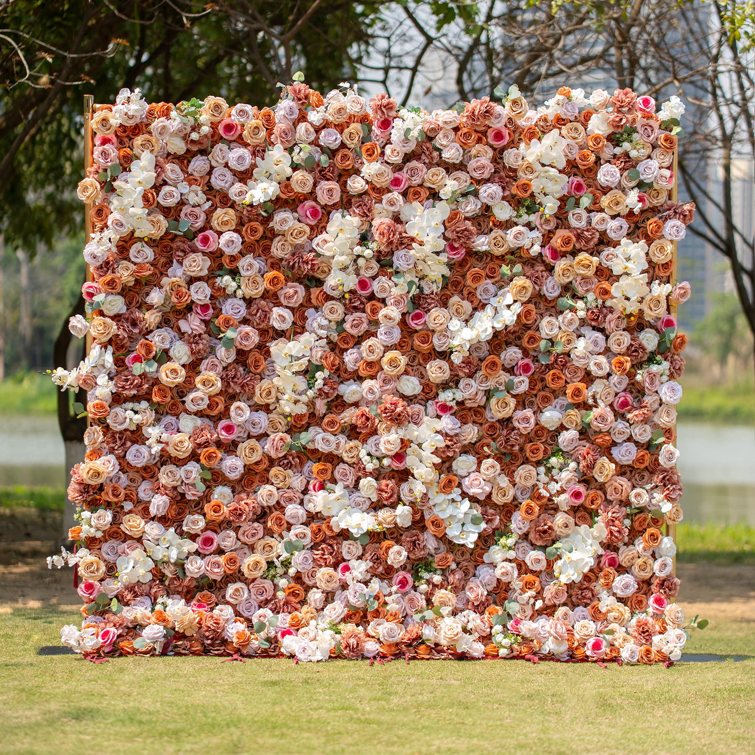 This backdrop exudes a warm, earthy charm with its theme colors of brown, beige, and white. Comprising roses and orchids, it creates a sophisticated look. Ideal for upscale events like weddings, corporate galas, or elegant garden parties.
