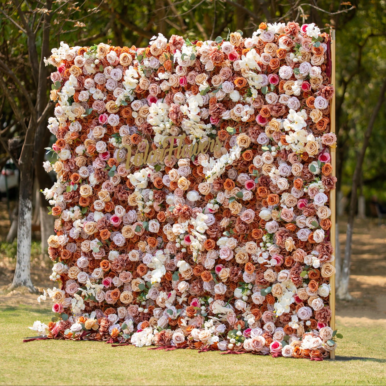 This backdrop features a warm, earthy theme color scheme with shades of brown, beige, and white. It is densely covered with roses and orchids. Ideal for elegant occasions such as weddings, upscale garden parties, and sophisticated corporate events.