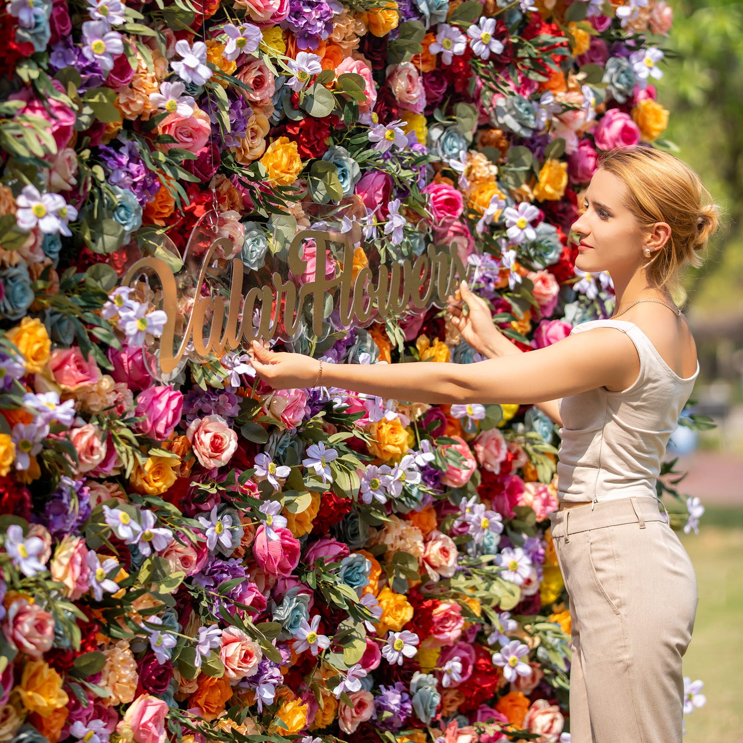 This backdrop is a kaleidoscope of colors, featuring hues like pink, orange, yellow, red, purple, and blue. It is densely packed with roses and small daisy - like flowers. Ideal for festive occasions such as outdoor weddings, garden parties, and celebratory events.