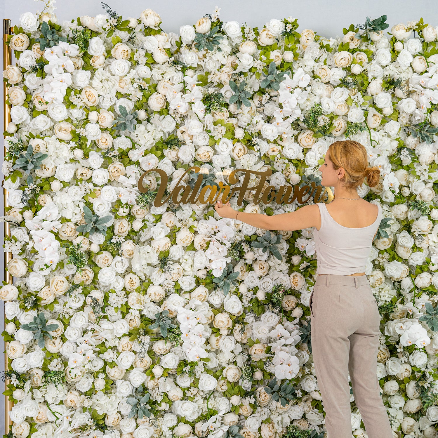 This backdrop features a lush arrangement of white roses, peonies, and orchids with green foliage. The white - green color theme exudes elegance, making it perfect for weddings, galas, or upscale events. The “Valar Flowers” sign adds a branded touch.
