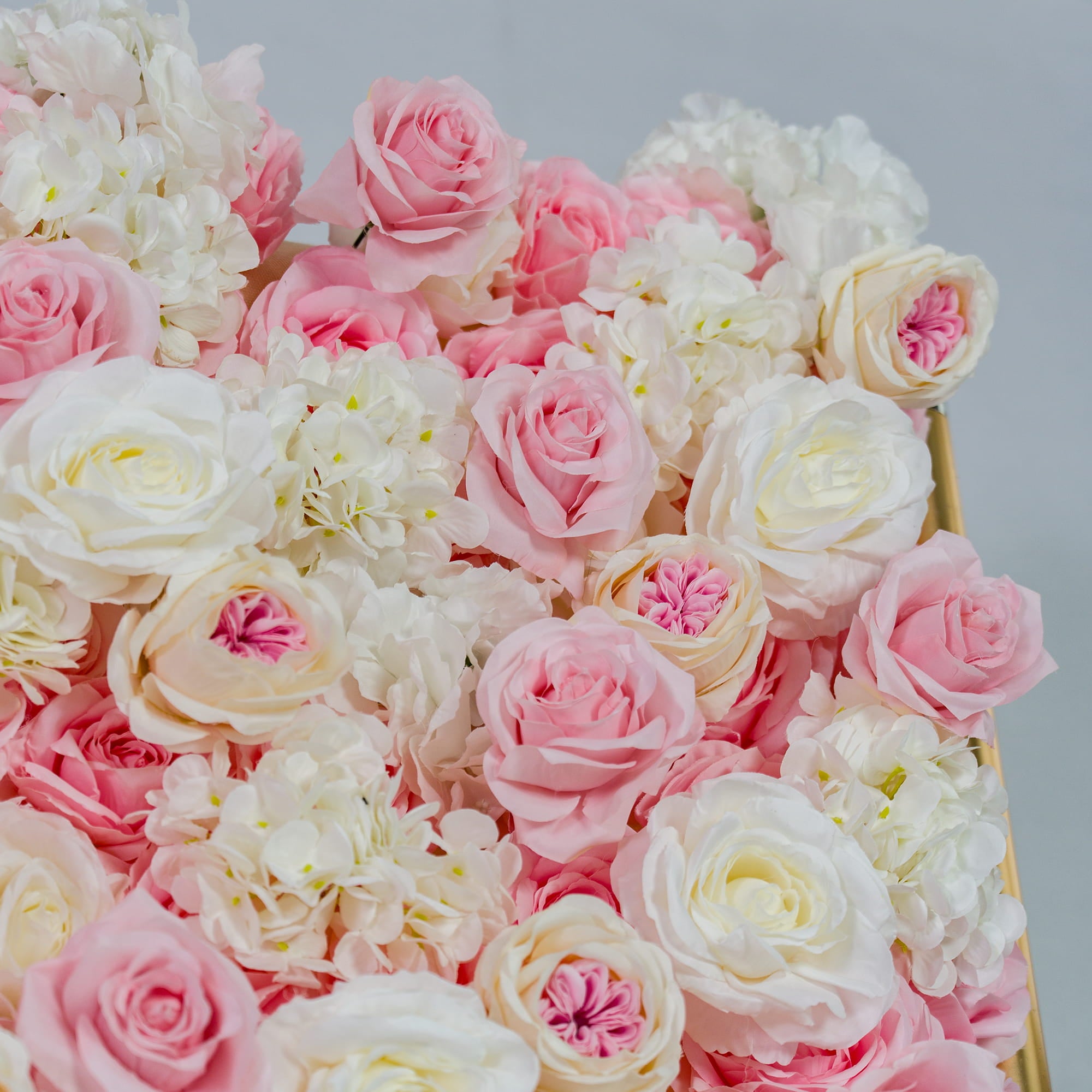 This photo captures a close - up of a lush floral arrangement. It features a mix of pink and white roses, along with white hydrangeas. The soft pastel colors create a romantic and elegant look. Ideal for weddings, bridal showers, or other romantic events, this backdrop exudes a dreamy and sophisticated style, making it perfect for adding a touch of romance to any occasion.