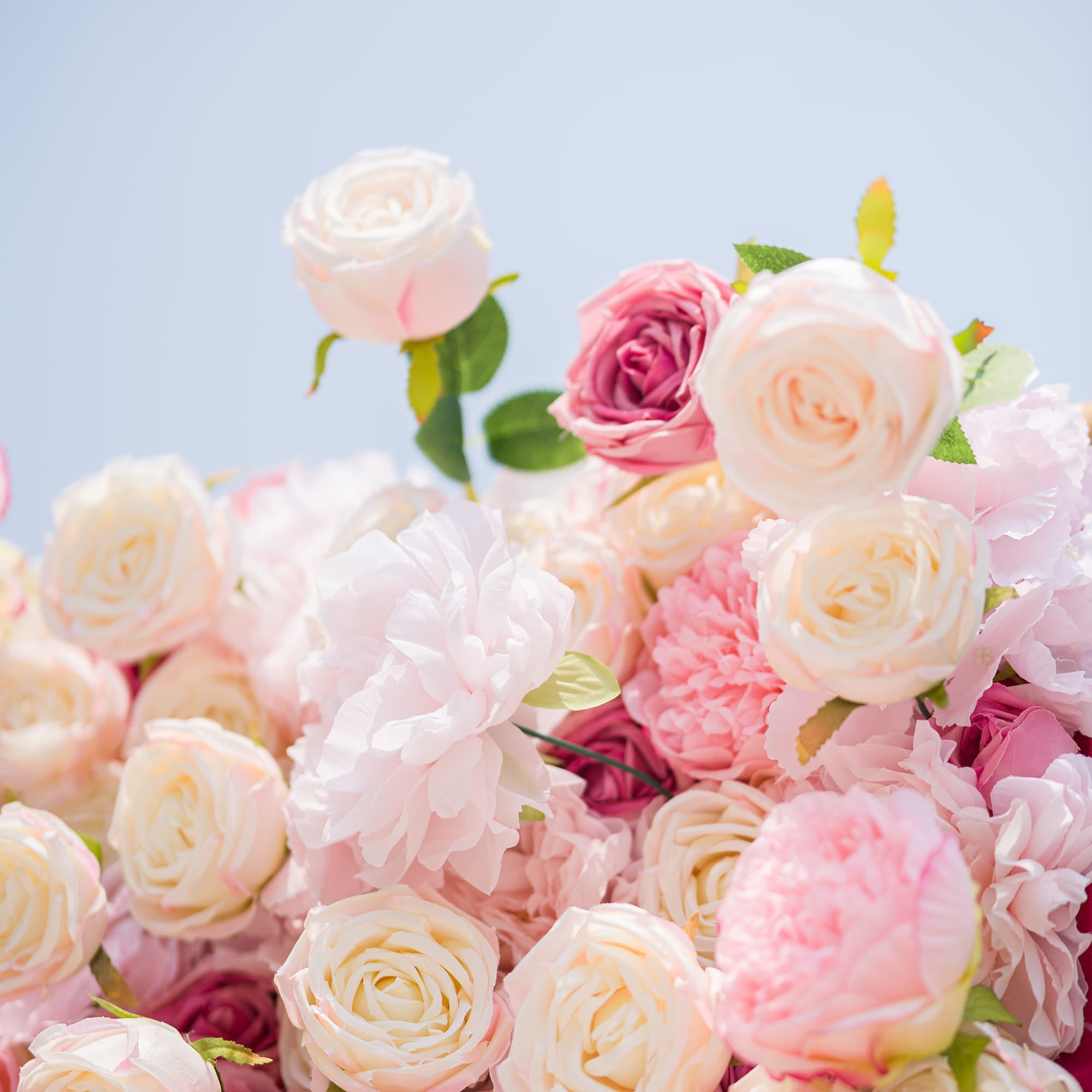 This photo from ValarFlowers features a large, opulent floral backdrop. It is densely adorned with an array of pink and white roses and peonies, creating a soft and romantic aesthetic. The backdrop is framed by metallic poles, adding a touch of modern elegance. Ideal for weddings, bridal showers, or a “Romantic Blush” - themed event, it serves as a beautiful and eye - catching decorative element, exuding charm and grace.