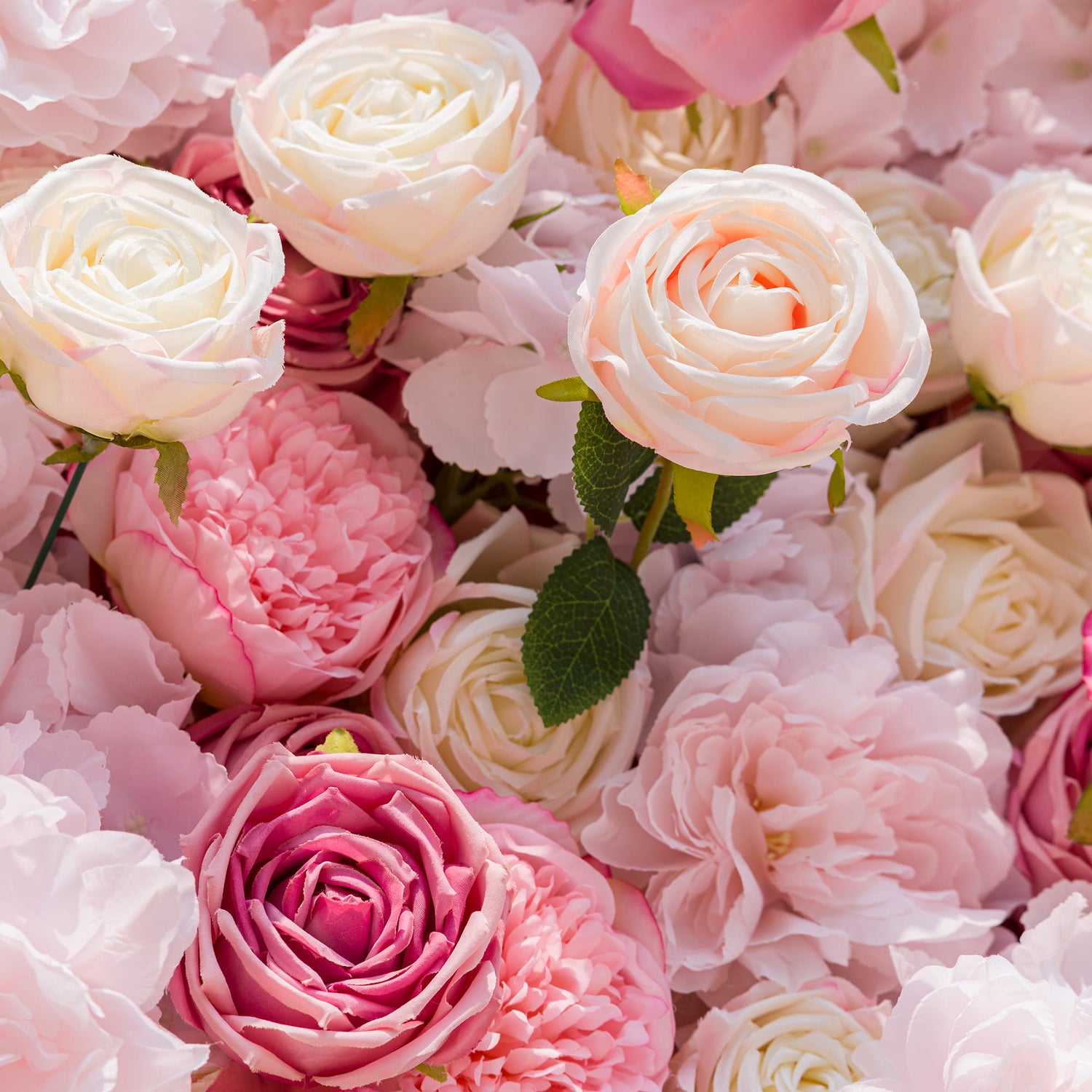 This photo from ValarFlowers displays a lush assembly of roses and peonies in a spectrum of pink and white hues. The roses, with their elegant spirals, and the peonies, boasting full, ruffled petals, create a soft and romantic visual. Ideal for weddings, engagement parties, or Valentine&