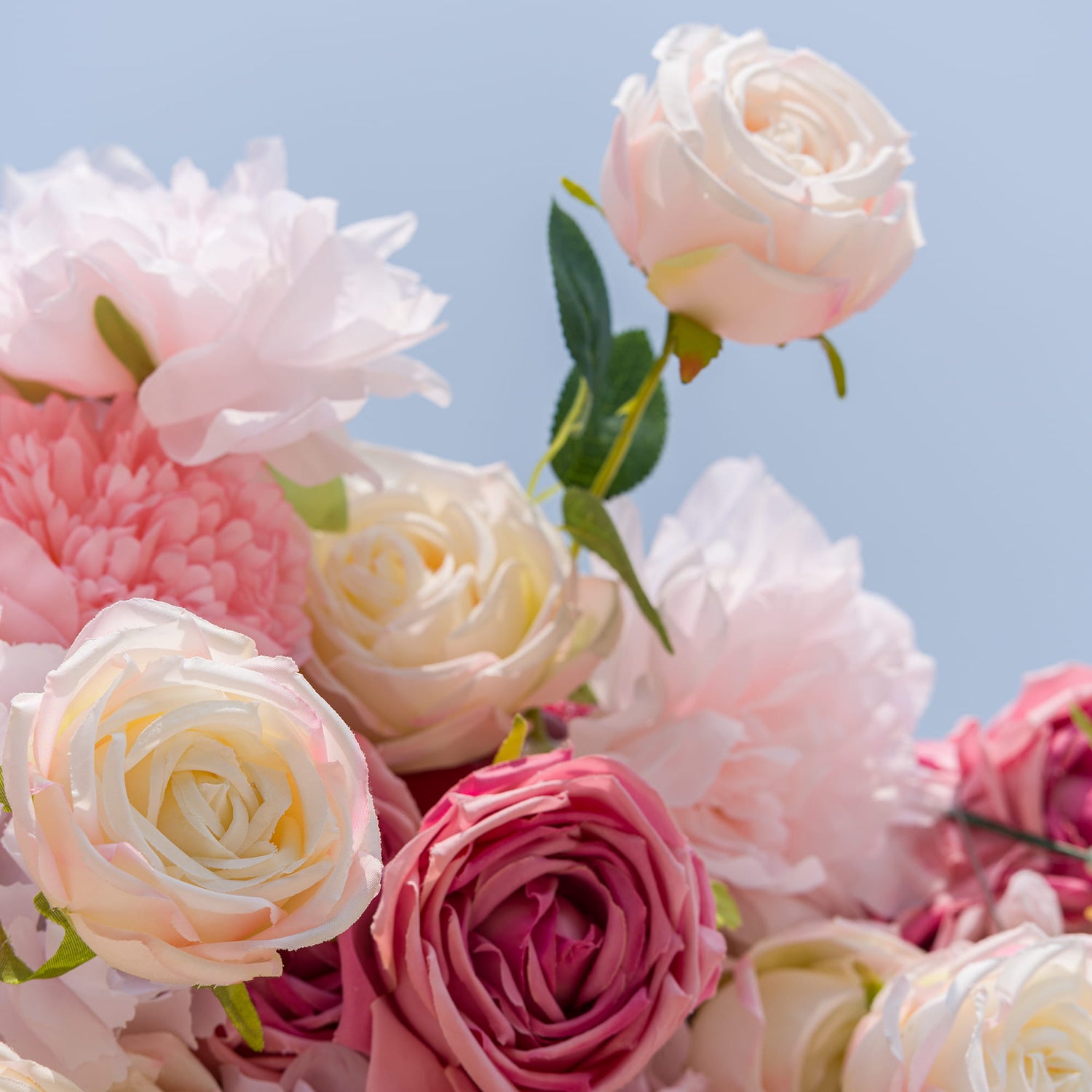 This photo from ValarFlowers presents a lush and vibrant arrangement of roses and peonies. The roses come in shades of cream and soft pink, while the peonies add a pop of deeper pink. Their delicate petals and fresh green leaves create a visually appealing contrast. Ideal for weddings, anniversary parties, or Valentine&