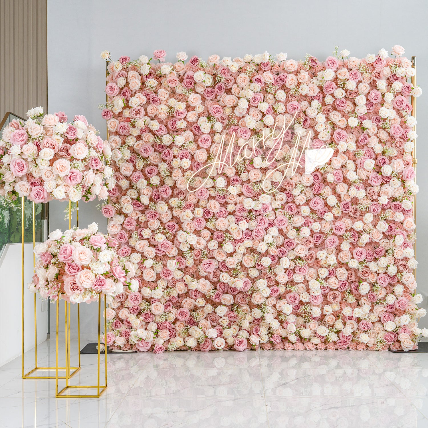 This photo showcases a stunning floral setup. A large backdrop is densely covered with pink and white roses, creating a dreamy and romantic atmosphere. The cursive text "Mary Me" adds a personalized touch. Flanking the backdrop are two golden - framed stands holding matching floral arrangements. Ideal for weddings or engagement parties, it exudes elegance and charm with its pastel color scheme.