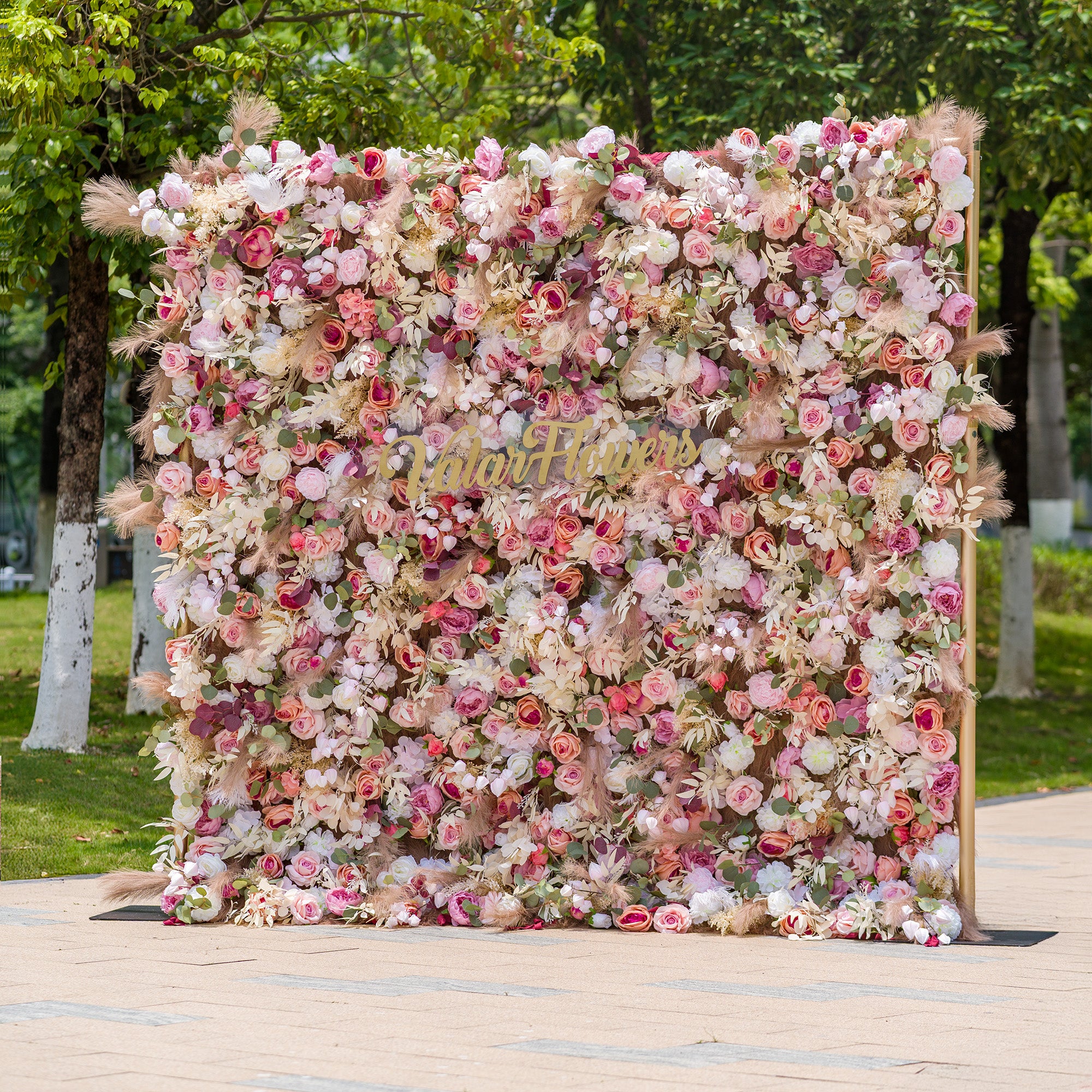 This photo showcases a 2.4x2.4m floral backdrop densely packed with an array of roses, peonies, and other blooms in soft pinks, whites, and hints of peach. Interspersed with green foliage and pampas grass, it exudes a romantic and elegant vibe. Ideal for events like a “Romantic Blush” wedding or a spring - themed garden party, it creates a dreamy atmosphere.