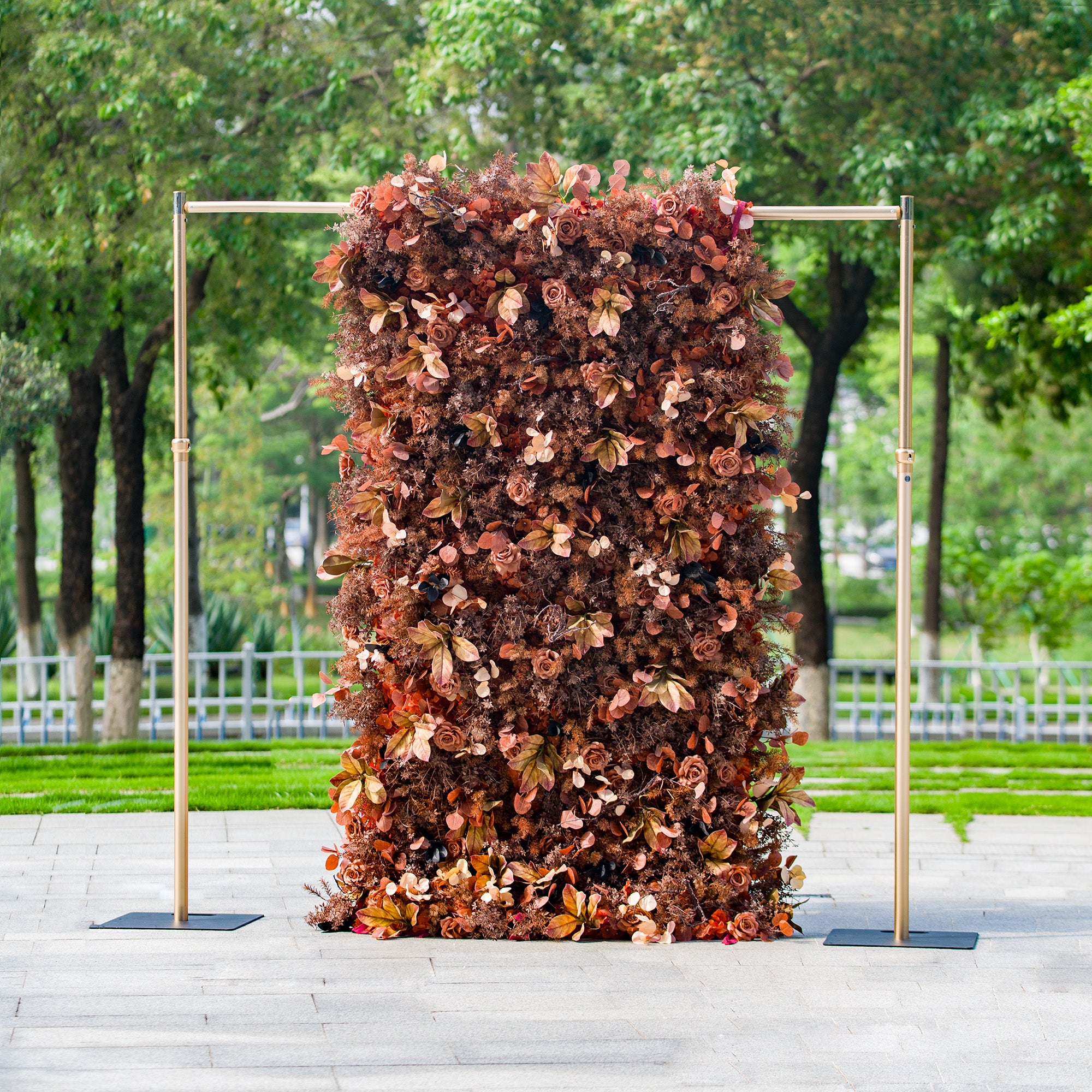 This 1.2x2.4m floral backdrop is densely adorned with autumn - themed flowers and foliage in rich shades of rust, brown, and copper. Set outdoors with greenery in the background, it exudes rustic charm. Ideal for events like an “Autumn Harvest” wedding or a fall - themed gala, it creates a warm, seasonal atmosphere.