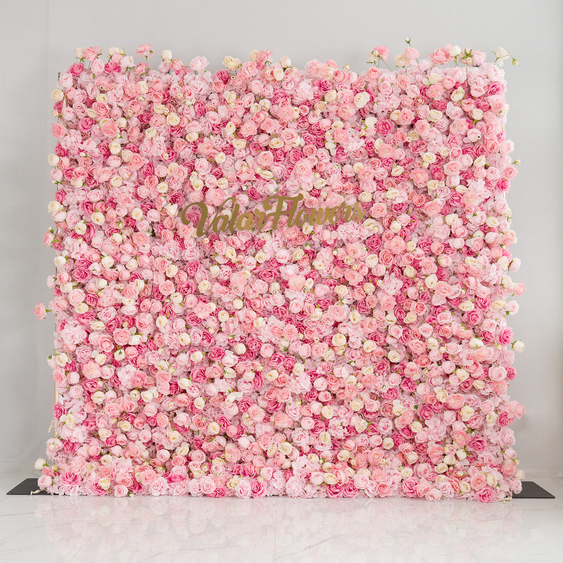This photo from ValarFlowers showcases a large, eye - catching floral backdrop. It is densely covered with Royal Roses in various shades of pink and white. These roses create a soft, romantic atmosphere. The backdrop is perfect for weddings, bridal showers, or other romantic events. The "ValarFlowers" logo is prominently displayed, signifying the brand&