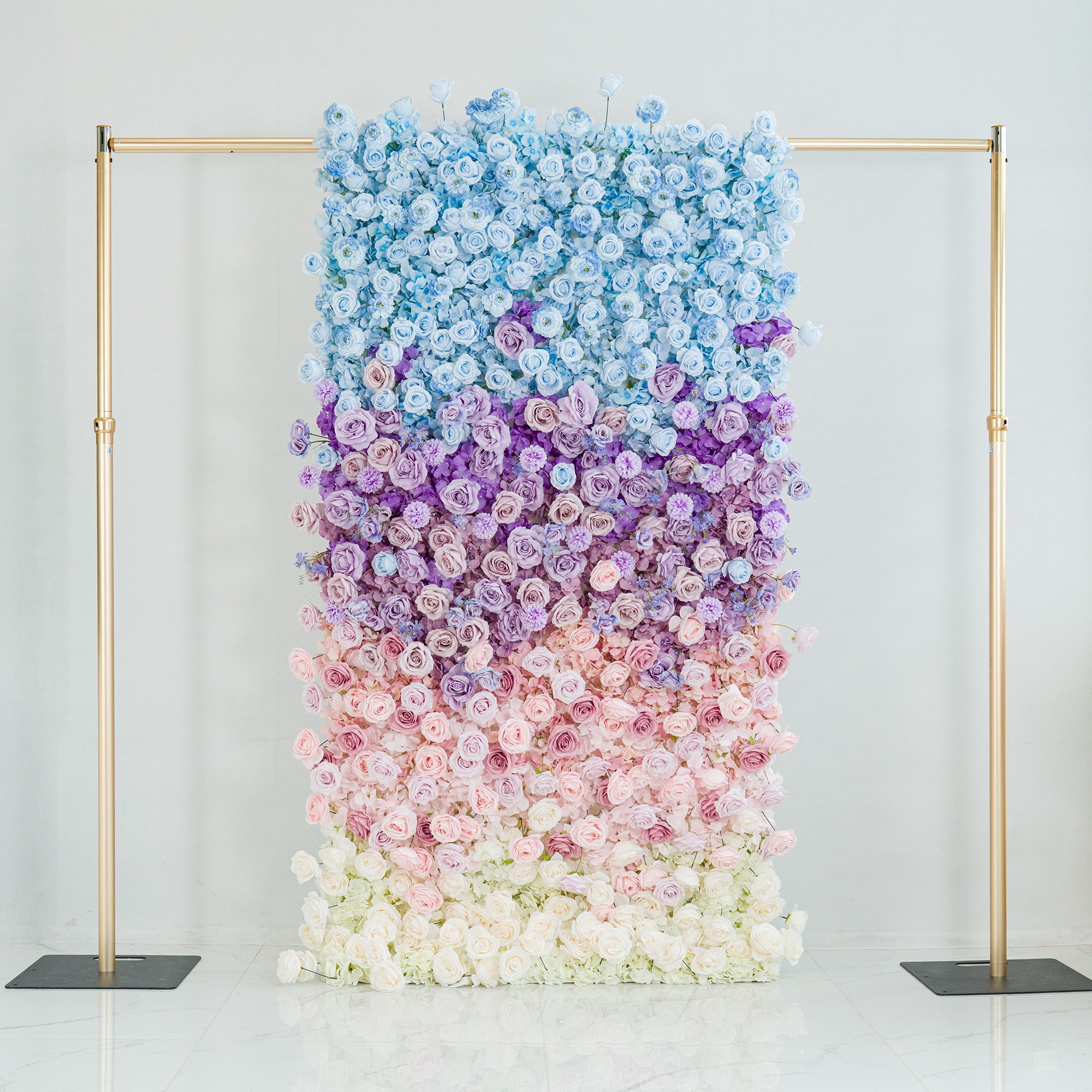 This stunning floral backdrop features a gradient of roses in hues of blue, purple, pink, and white. The ombre color theme, transitioning smoothly from sky - blue at the top to soft white at the base, creates a dreamy, elegant vibe. Framed by gold poles, it’s perfect for weddings, galas, or upscale events, serving as a sophisticated, photo - worthy centerpiece that blends natural beauty with polished design.