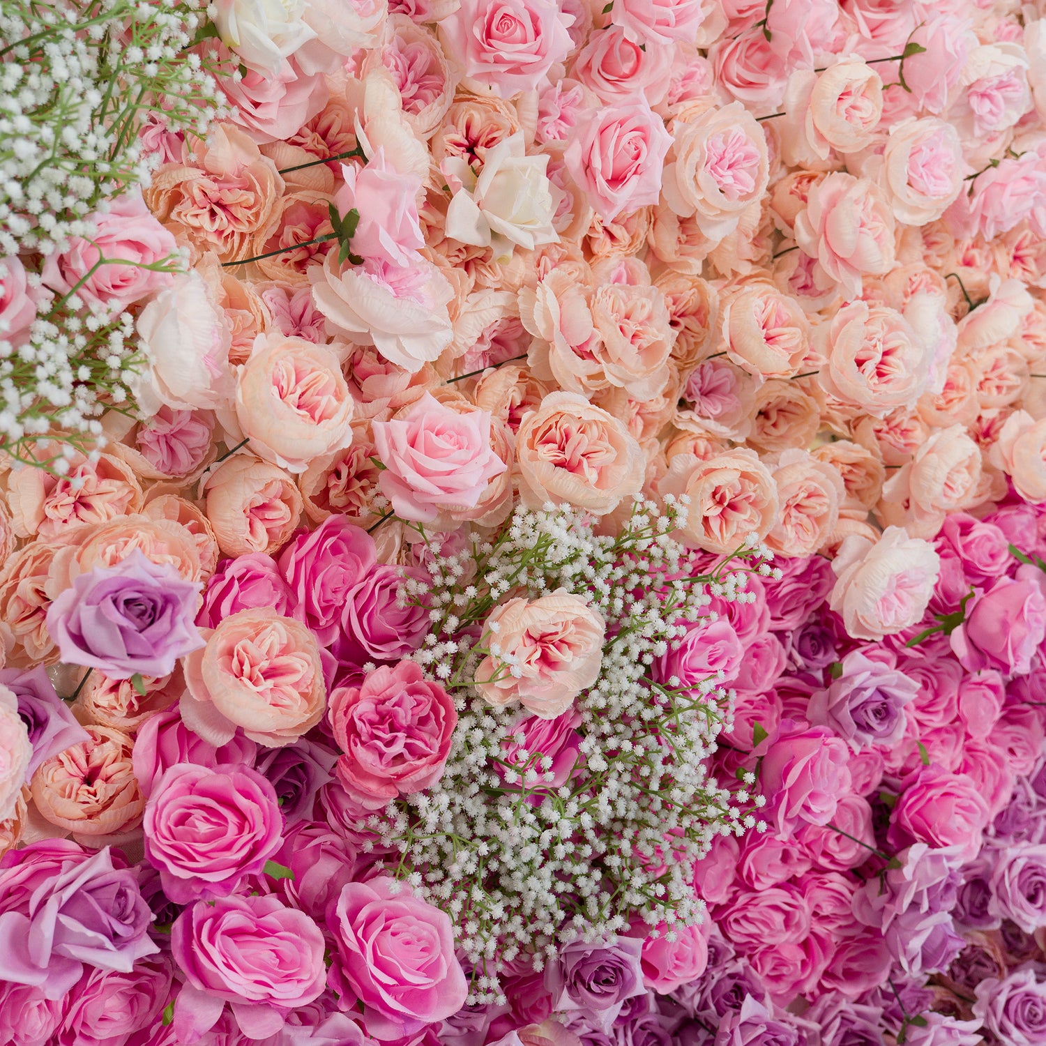 This lush floral wall features pink, peach, and purple roses, plus baby’s breath. The soft, pastel - hued color theme (pink to lavender gradients) creates a romantic, whimsical vibe—perfect for weddings, bridal showers, or feminine - focused events. The dense arrangement of blooms and delicate filler flowers adds elegance, ideal as a photo backdrop or decorative centerpiece.