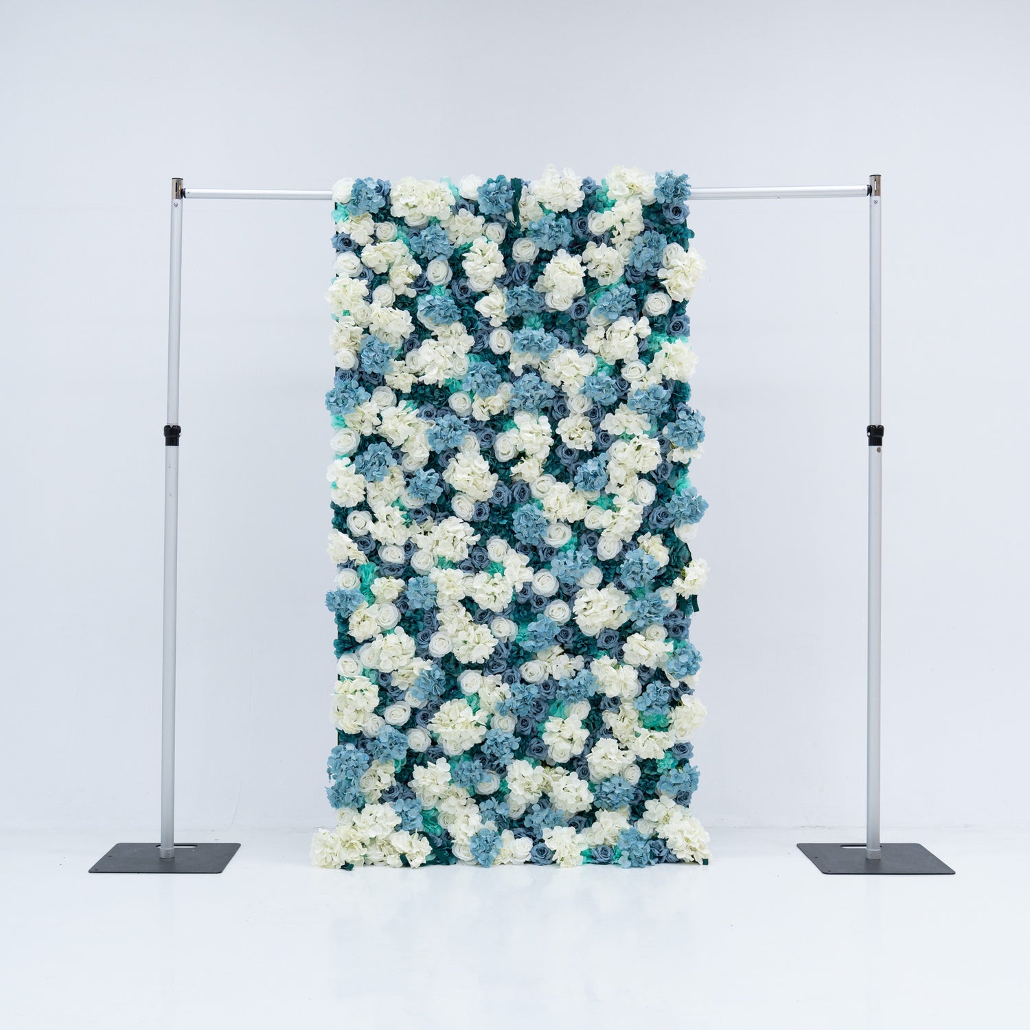 This 4x8ft flower wall from Valar Flowers is a stunning display of artificial roses in white and various shades of blue. The dense arrangement creates a visually appealing and vibrant backdrop, perfect for weddings, photo shoots, or other special events with a blue and white color theme. The meticulous arrangement of the roses enhances the overall aesthetic, adding a touch of sophistication and natural beauty to any setting.