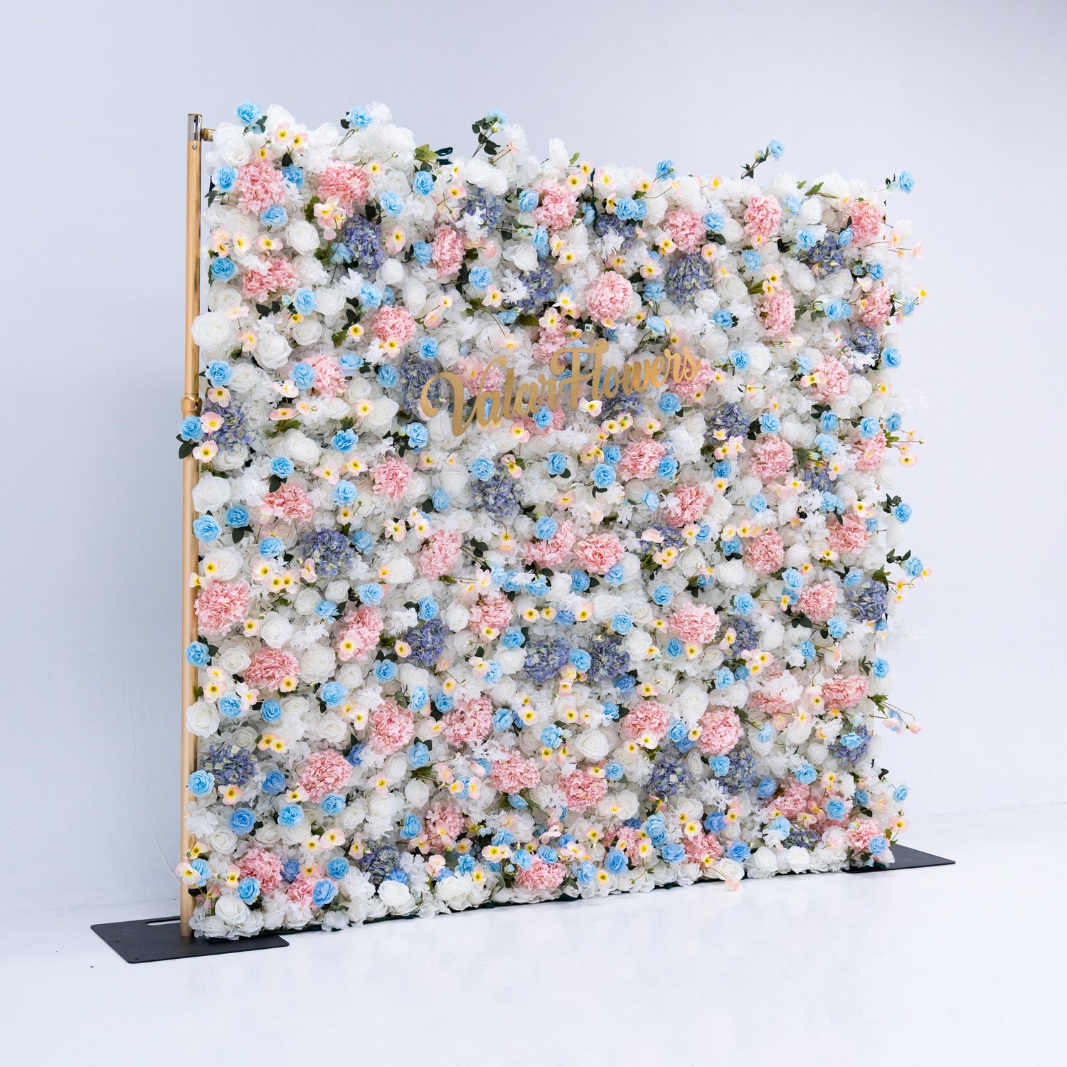 The meticulous arrangement of the flowers enhances the overall aesthetic, adding a touch of natural beauty and charm to any setting. This floral backdrop is perfect for events with a pastel color theme, adding a romantic and whimsical atmosphere to any occasion.