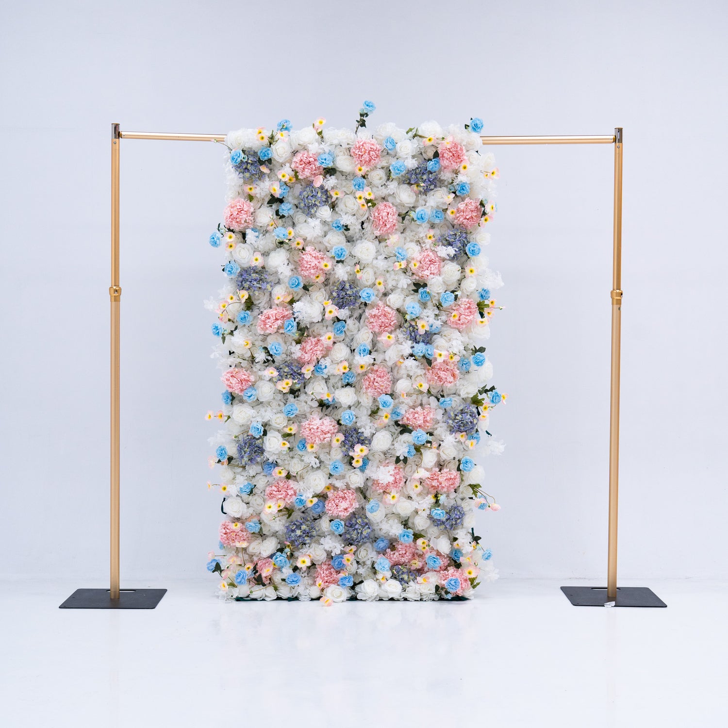 This 4x8ft flower wall is a stunning display of artificial roses in white, pink, and various shades of blue. The dense arrangement creates a visually appealing and vibrant backdrop, perfect for weddings, photo shoots, or other special events with a pastel color theme. The meticulous arrangement of the flowers enhances the overall aesthetic, adding a touch of sophistication and natural beauty to any setting.