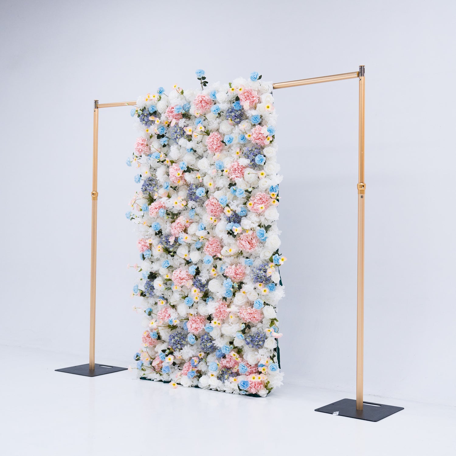 This 4x8ft flower wall is a stunning display of artificial roses in white, pink, and various shades of blue. The dense arrangement creates a visually appealing and vibrant backdrop, perfect for weddings, photo shoots, or other special events with a pastel color theme. The meticulous arrangement of the flowers enhances the overall aesthetic, adding a touch of sophistication and natural beauty to any setting.