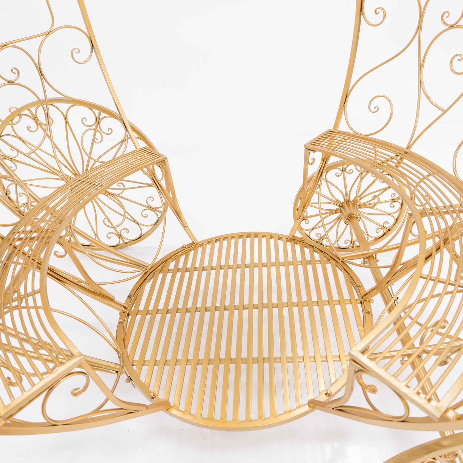 This is the seat of a golden, ornate Cinderella - style carriage. Intricate wrought - iron scrollwork frames the circular, slatted seat. The shimmering gold finish and delicate designs create a fairy - tale charm, perfect for themed events.