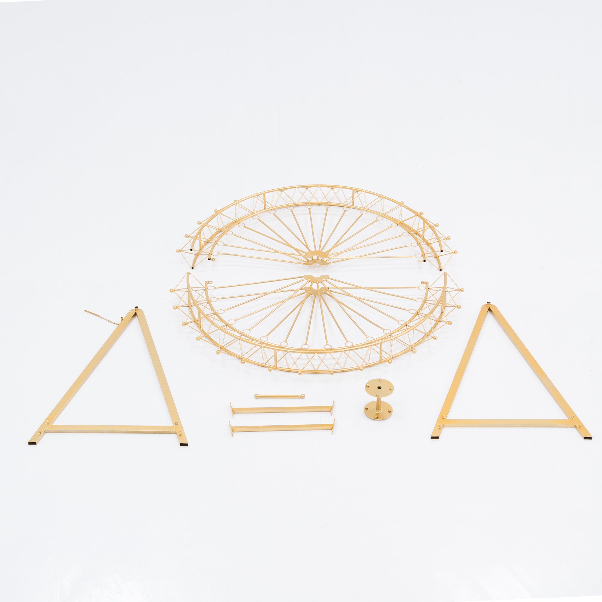Unassembled parts of a golden Ferris wheel decoration. Includes a circular frame with spokes, two triangular stands, and small metal components. Designed for easy assembly, perfect for decorative, themed event setups.
