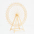 A golden metal Ferris wheel decoration with an open, intricate lattice design. It features a triangular stand and circular spokes, creating a delicate, ornamental structure. The shimmering gold finish adds elegance, perfect for decorative event setups.