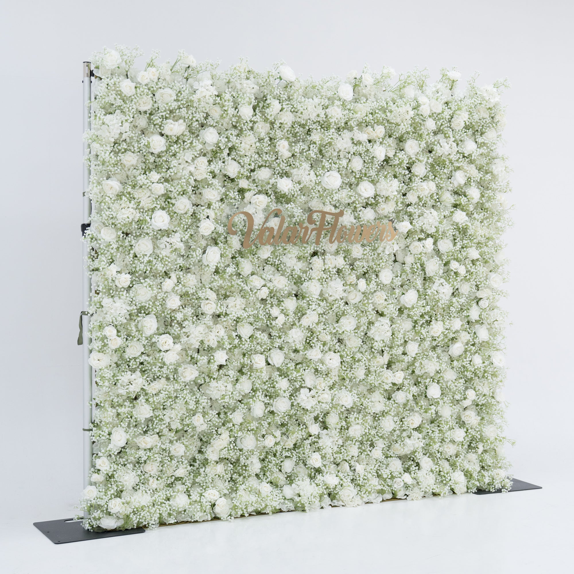 This image features a large, square floral wall densely covered with white flowers, including baby&