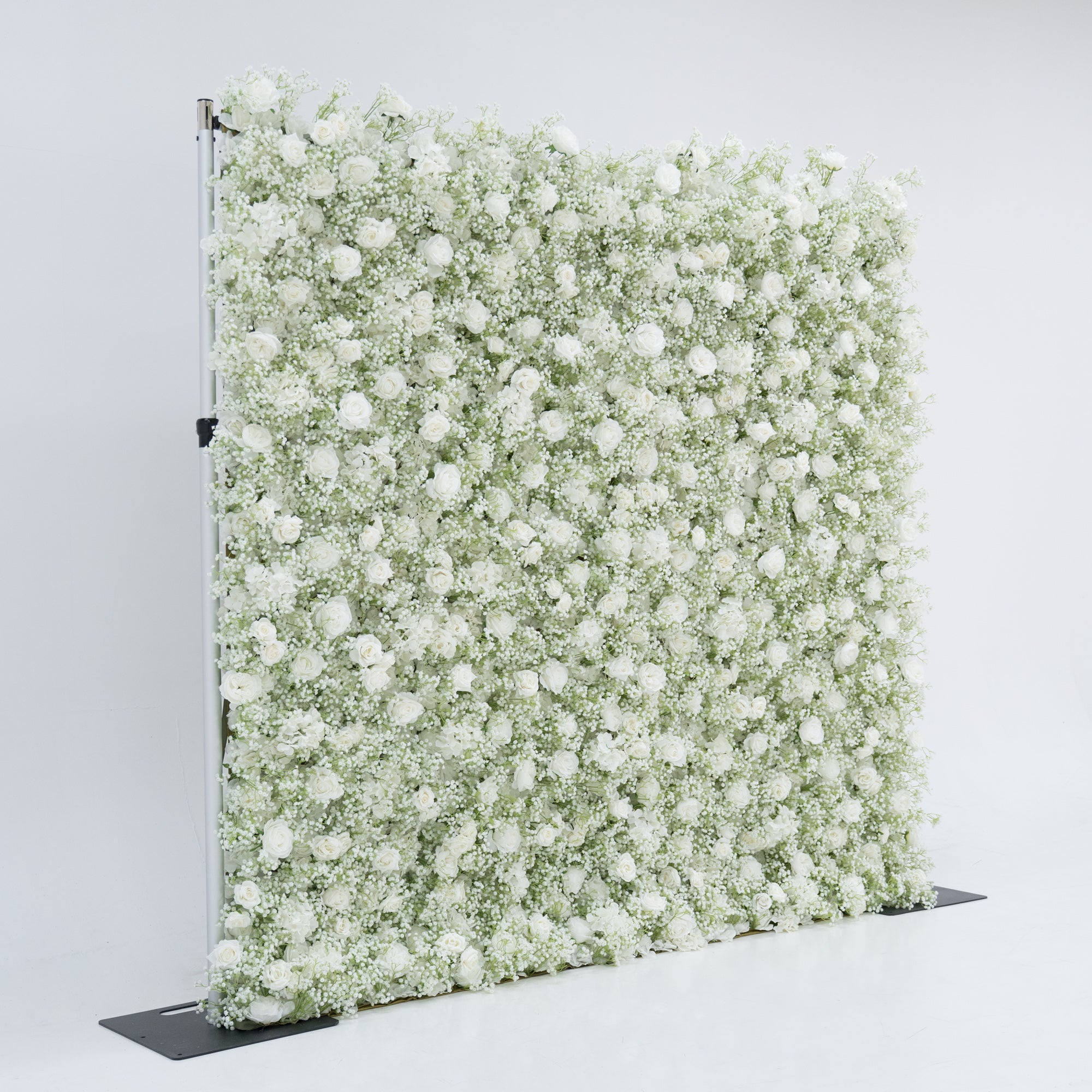 This image displays an 8x8ft floral wall by Valar Flowers, densely covered with white roses and baby&