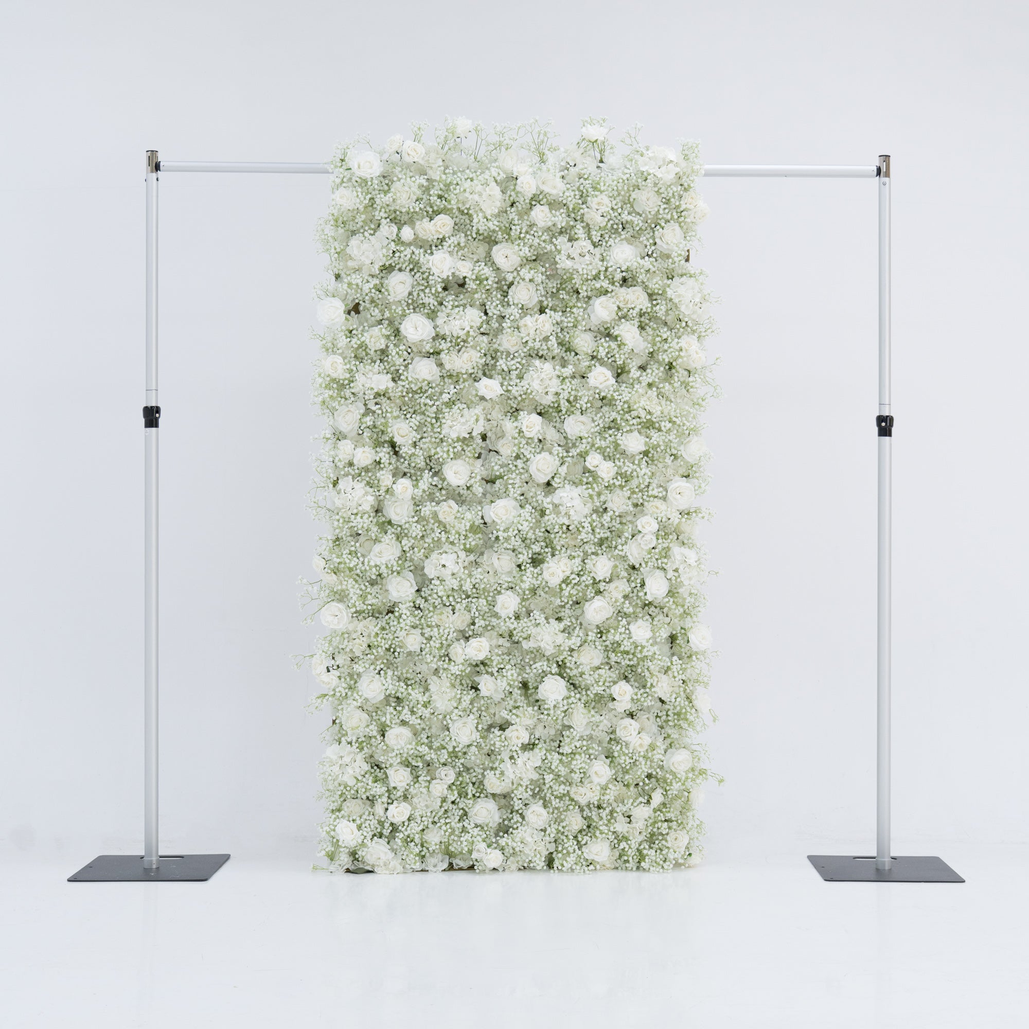 This image showcases a 4x8ft floral wall by Valar Flowers, densely adorned with white roses and baby&