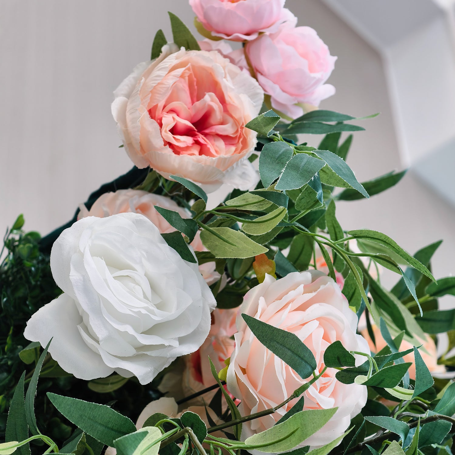 This photo features a lush arrangement of white, pink, and peach roses interwoven with green foliage. The soft, pastel - colored blooms create a romantic and elegant atmosphere. Ideal for events like a "Blossoming Love" vow renewal or a high - end ladies&