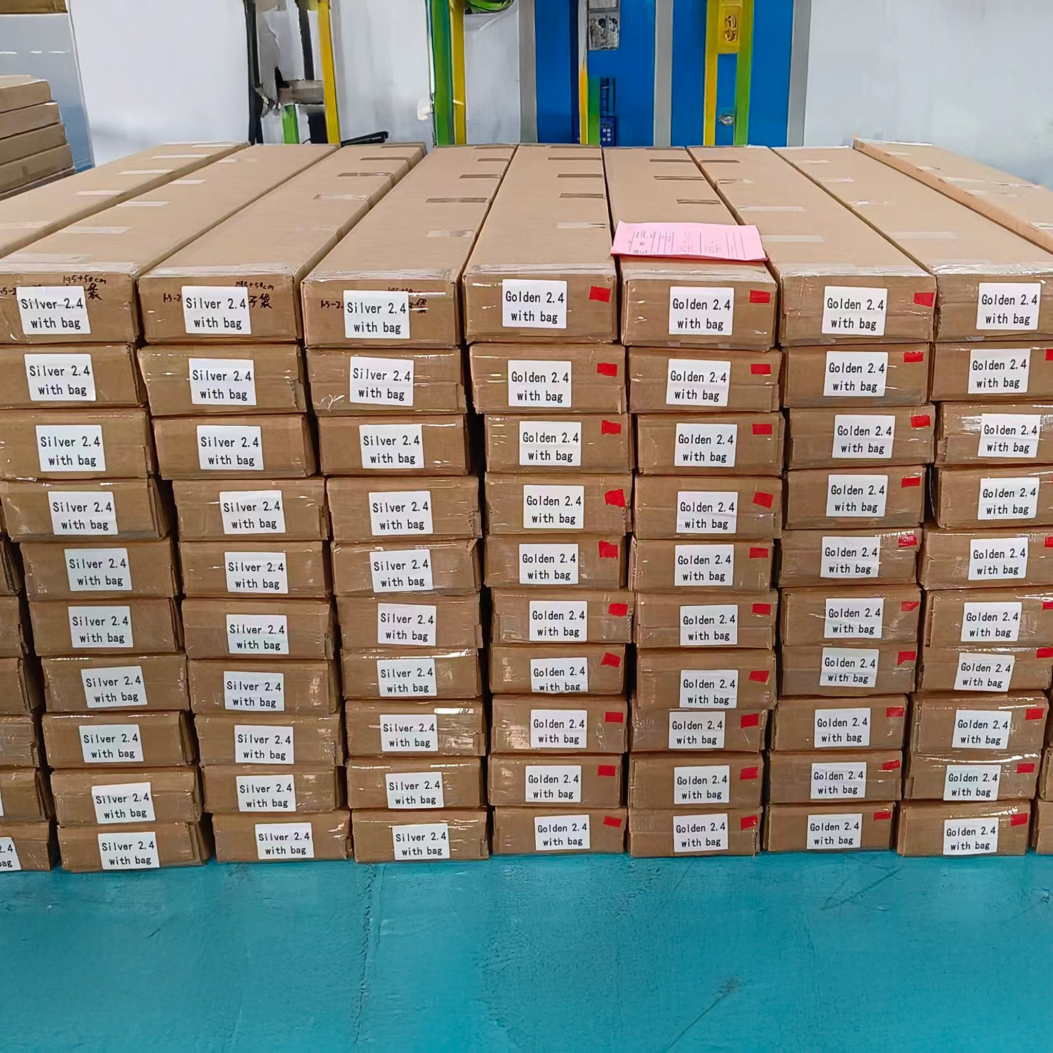 Many stacks of brown cardboard boxes with labels in a warehouse setting.