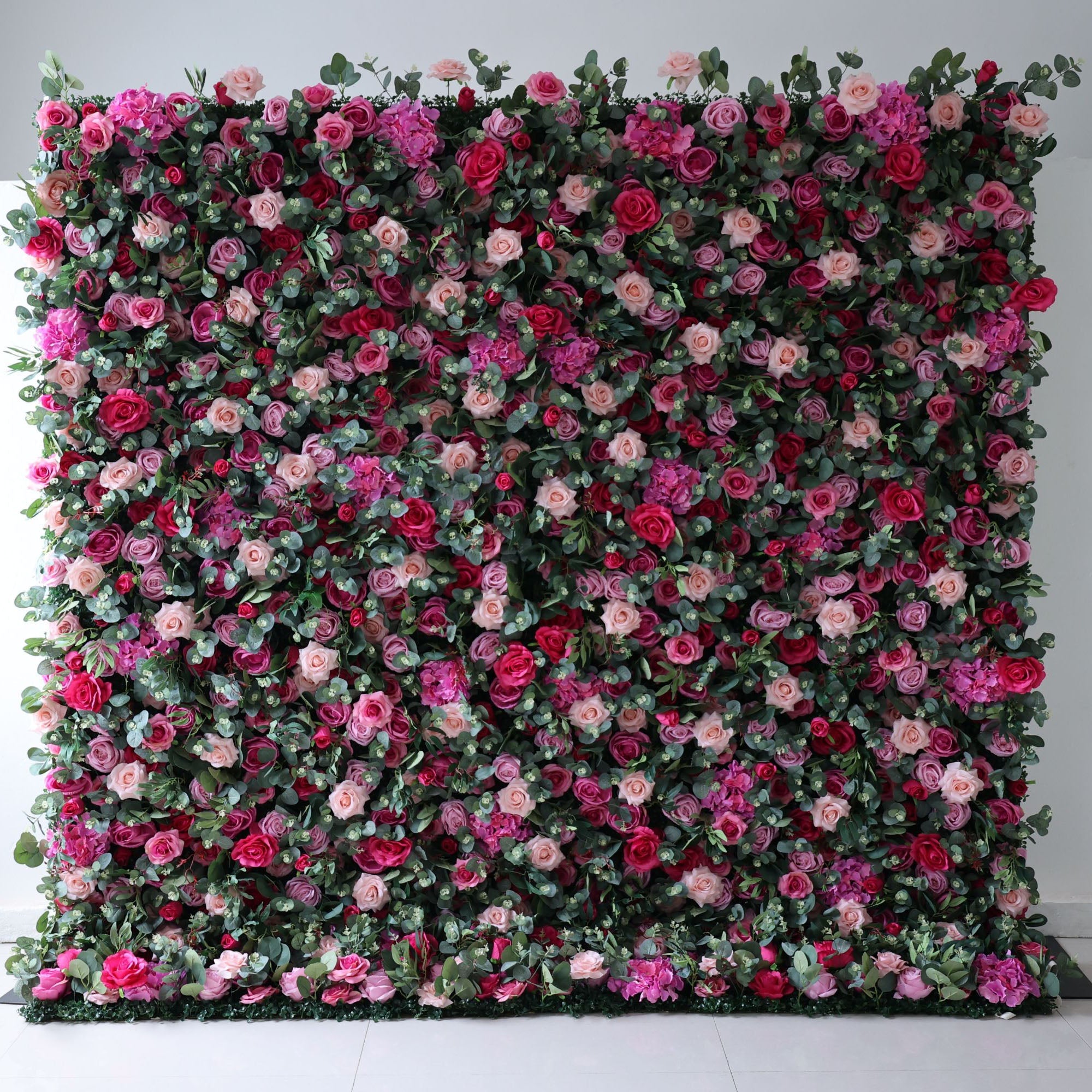 Valar Flowers premium roll-up fabric artificial flower wall backdrop featuring a vibrant mix of silk roses and blossoms, creating a lush, romantic display for weddings, events, and photography.