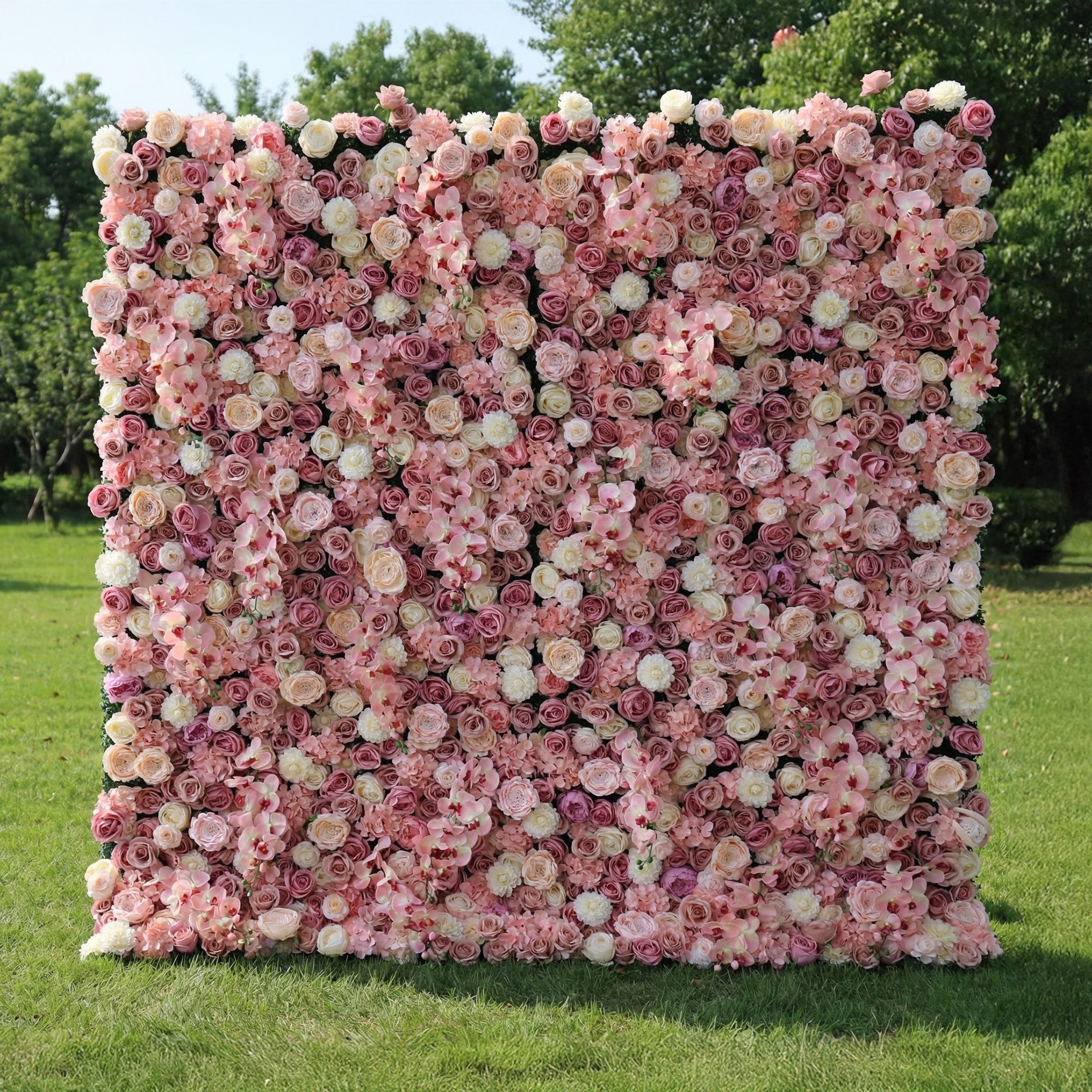This is a full-size 8x8ft Valar Flowers premium blush pink artificial flower wall backdrop, featuring a lush, dense arrangement of lifelike roses, orchids, and hydrangeas in soft pink, champagne, and ivory tones. This high-quality, reusable floral display creates an elegant, romantic focal point, ideal for wedding backdrops, photo booths, garden parties, and luxury outdoor event styling, delivering maintenance-free, long-lasting beauty for professional event decor.