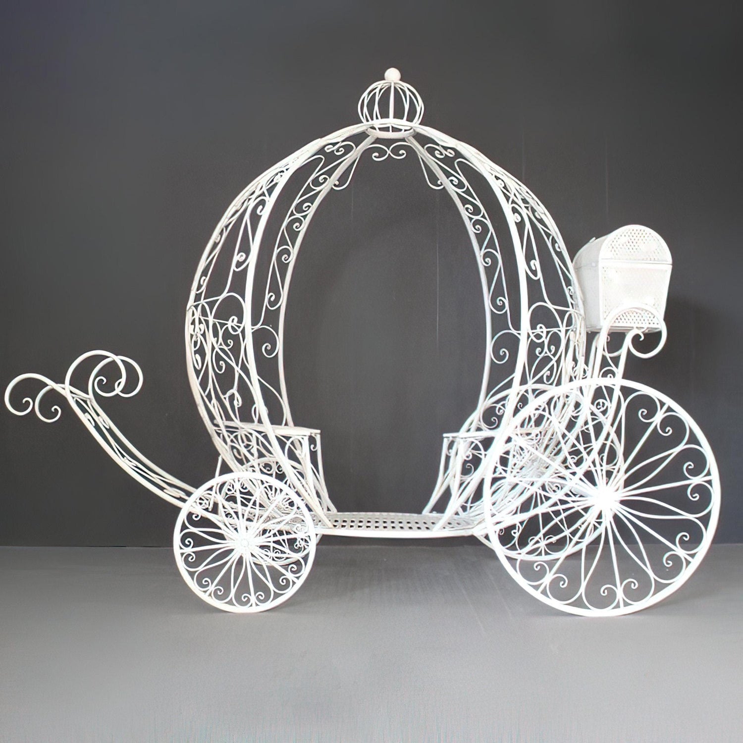 This elegant white metal carriage by &