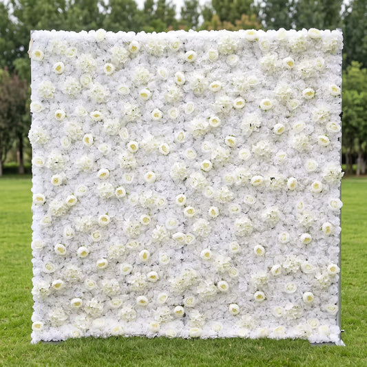 Luxury full-size all-white artificial flower wall densely layered with soft peonies, round roses and fluffy hydrangea blooms, displayed on a green outdoor lawn. This reusable, maintenance-free floral backdrop delivers clean minimalist elegance, perfect for wedding photo booths, bridal events, baptism parties, boutique store displays and minimalist content shoots for timeless, bright Instagram-ready aesthetic decor.