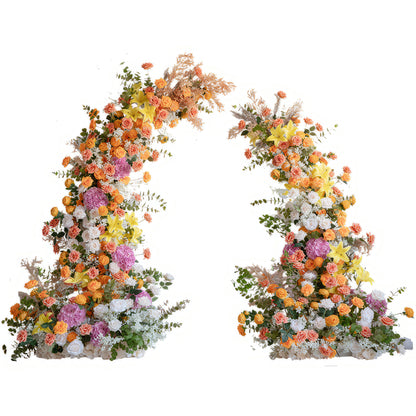 This is a floral arch composed of a variety of colorful flowers. It uses a rich palette of hues such as orange, yellow, pink, and white, featuring flowers like roses, hydrangeas, and lilies. It is also paired with green foliage and some dried plant elements. The overall style is lively and full of layers, making it perfect for the decoration of events like weddings and celebrations, and it can create a warm and romantic atmosphere. 