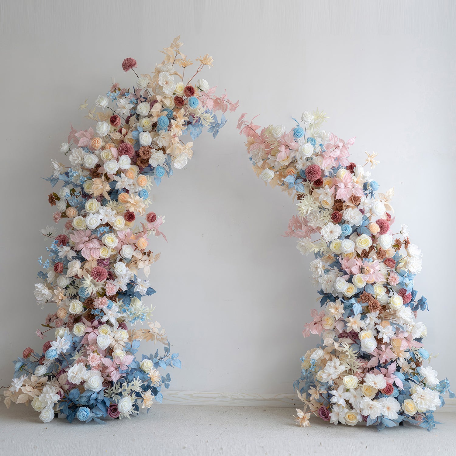 This flower - covered arch showcases a pastel symphony of soft blues, pinks, whites, and warm earthy tones. It combines roses, dahlias, and other blossoms, creating a romantic and dreamy style. Ideal for weddings, events, and photoshoots to add a touch of charm. 